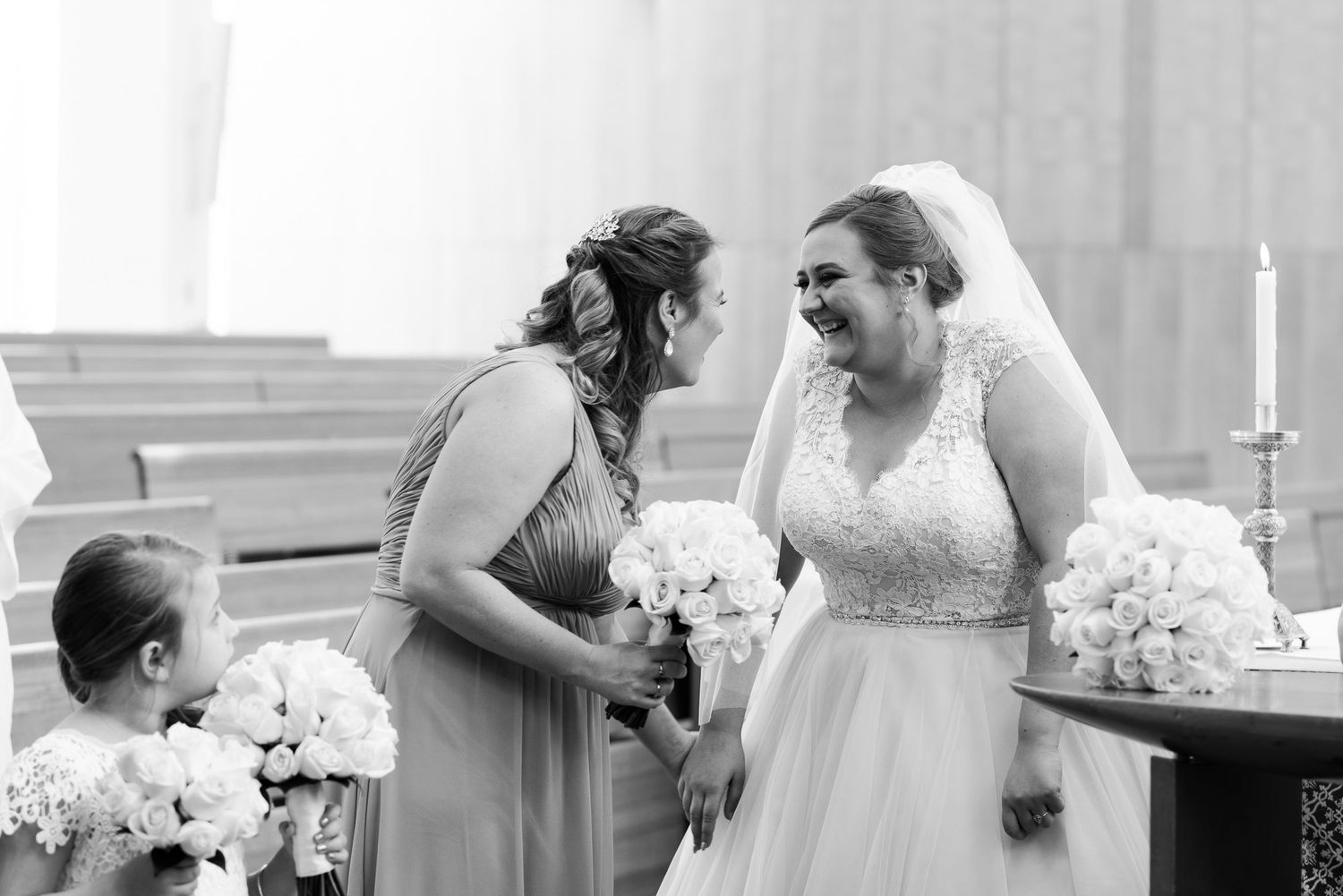 Wedding party members share emotional moments during the celebration.