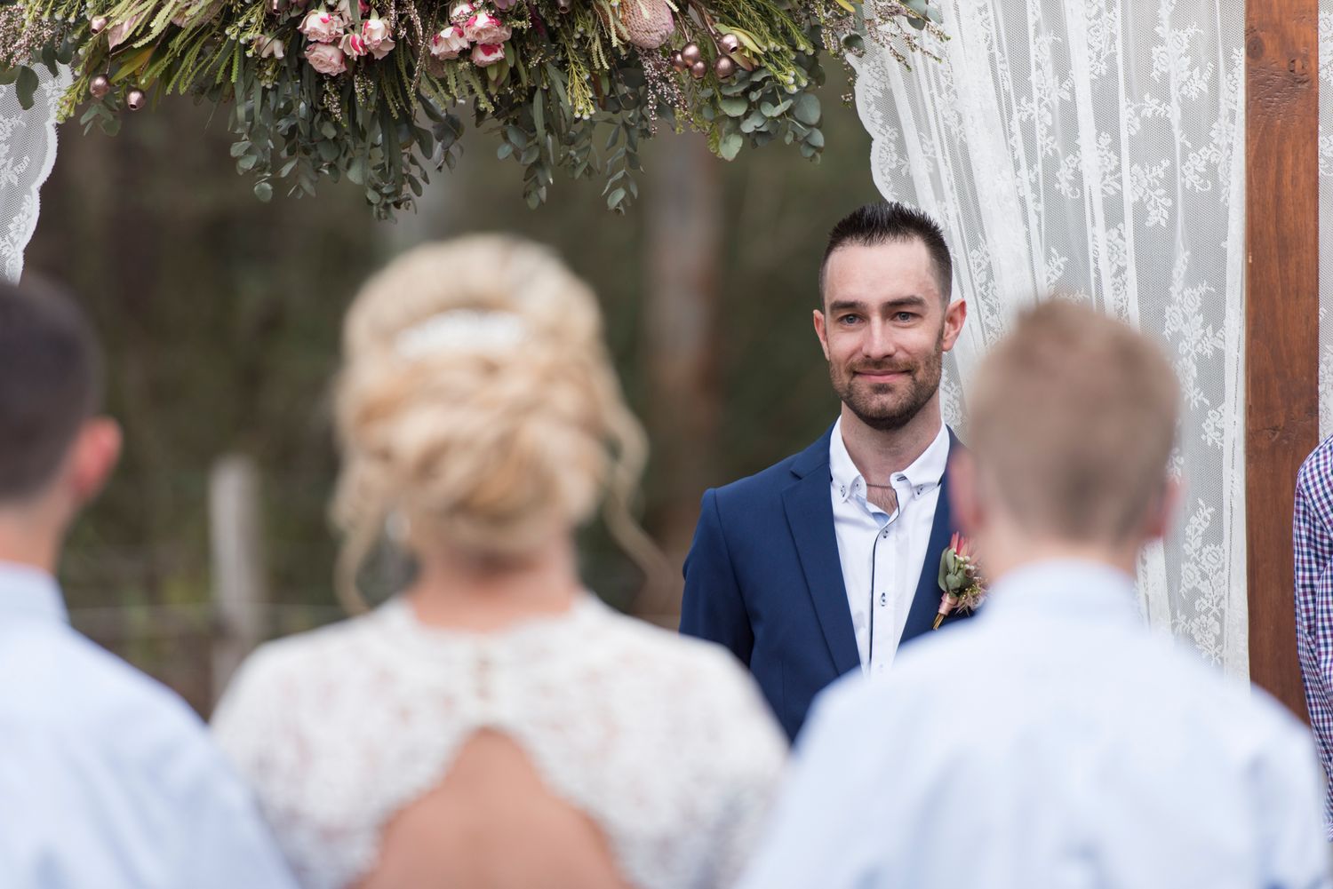 Grooms reaction to seeing bride walk down isle.