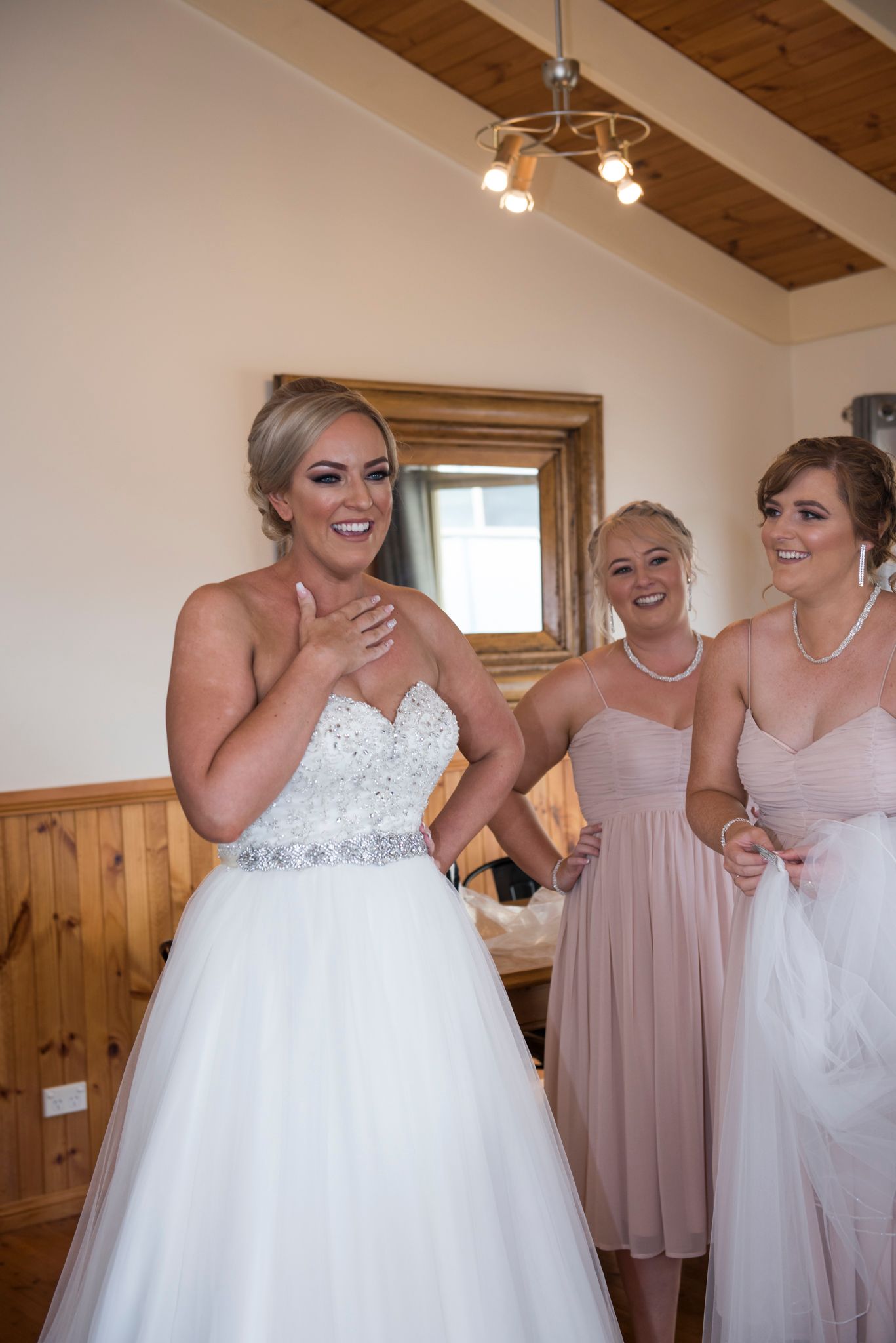Candid moments of laughter and joy shared during wedding preparations.