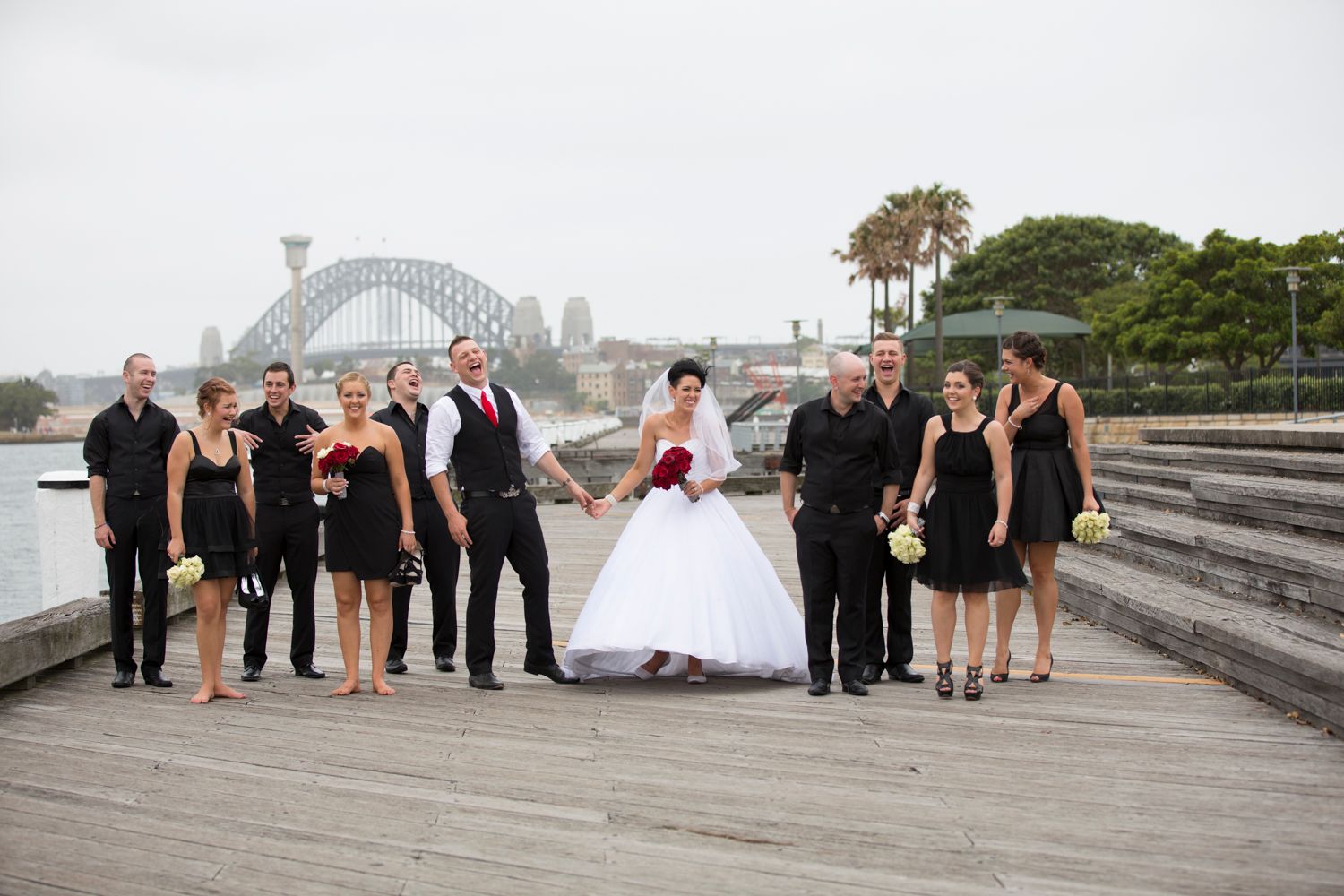 Wedding party group photos with Sydney Harbour Bridge visible in the background.