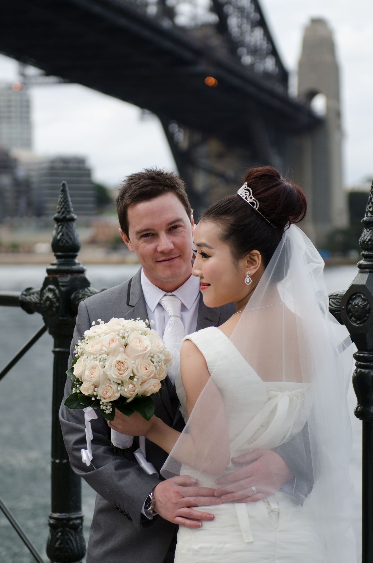 Romantic waterfront wedding photos with Sydney Harbour Bridge in the background.