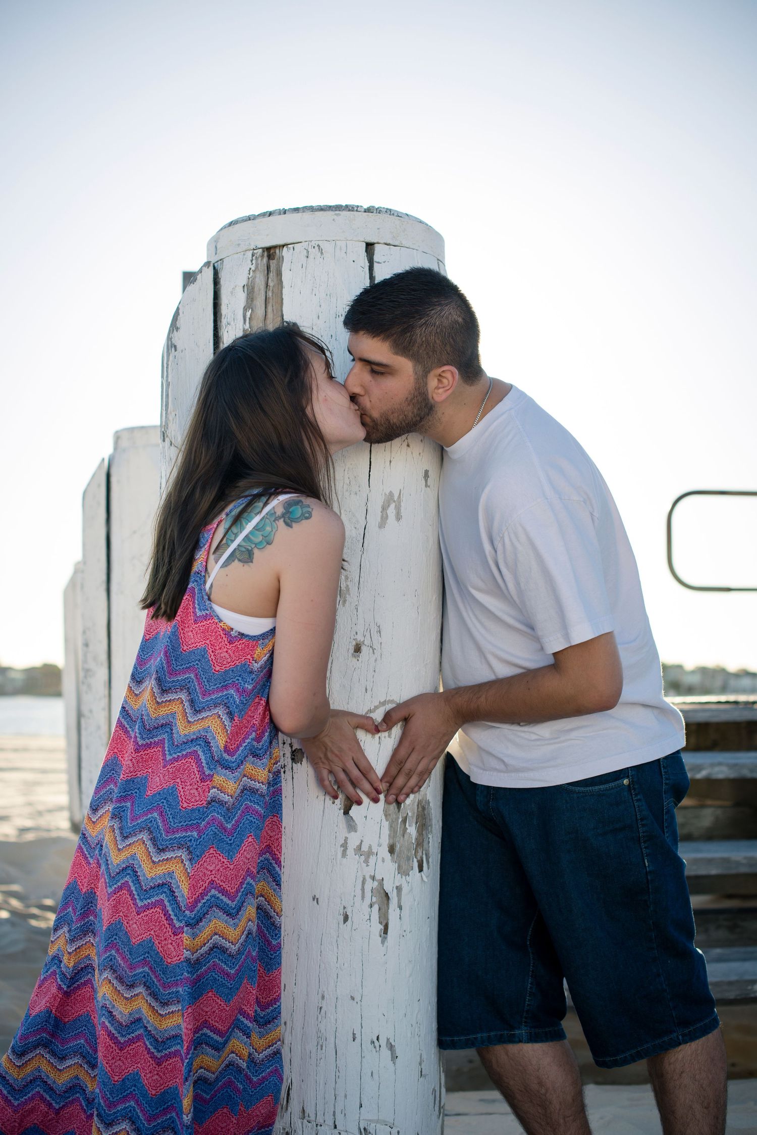 Romantic couple shares intimate moments at the beach.