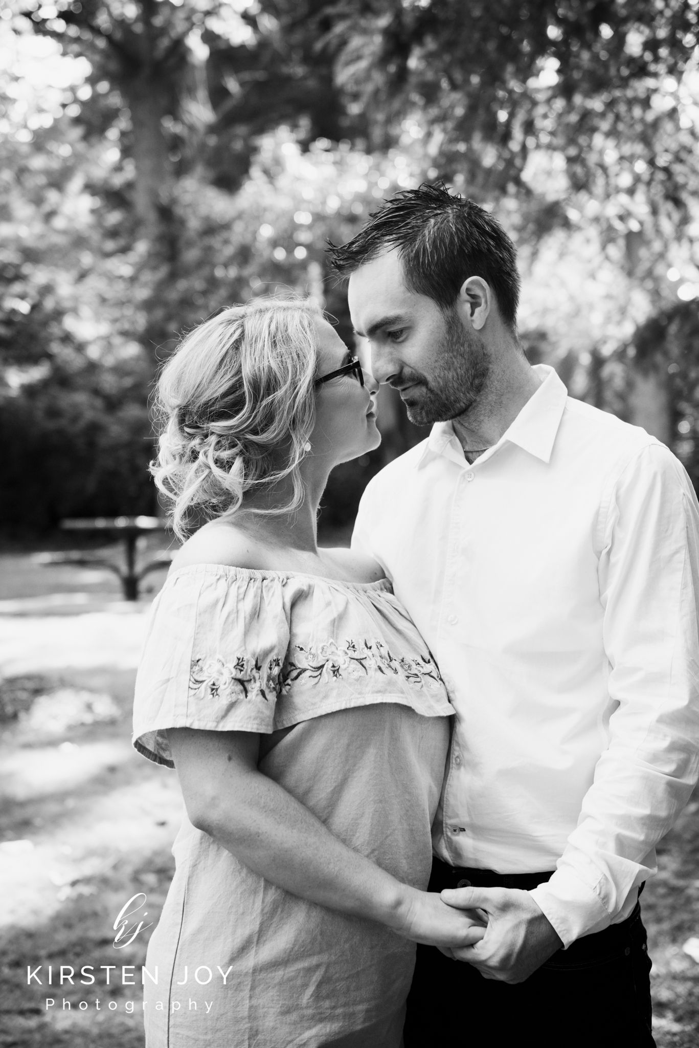 Black and white series of intimate moments captured in a natural outdoor setting.