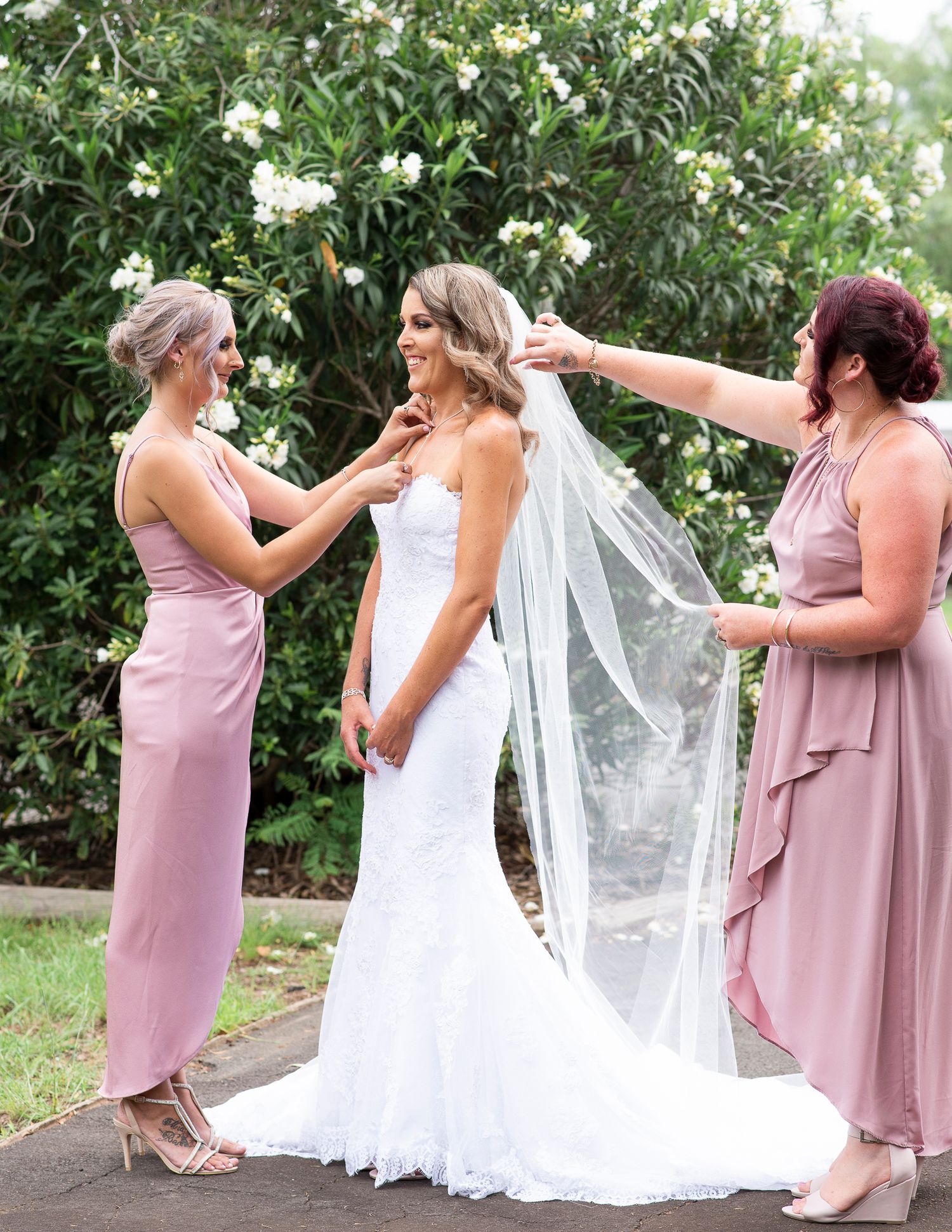 Bride being prepped before the ceremony.