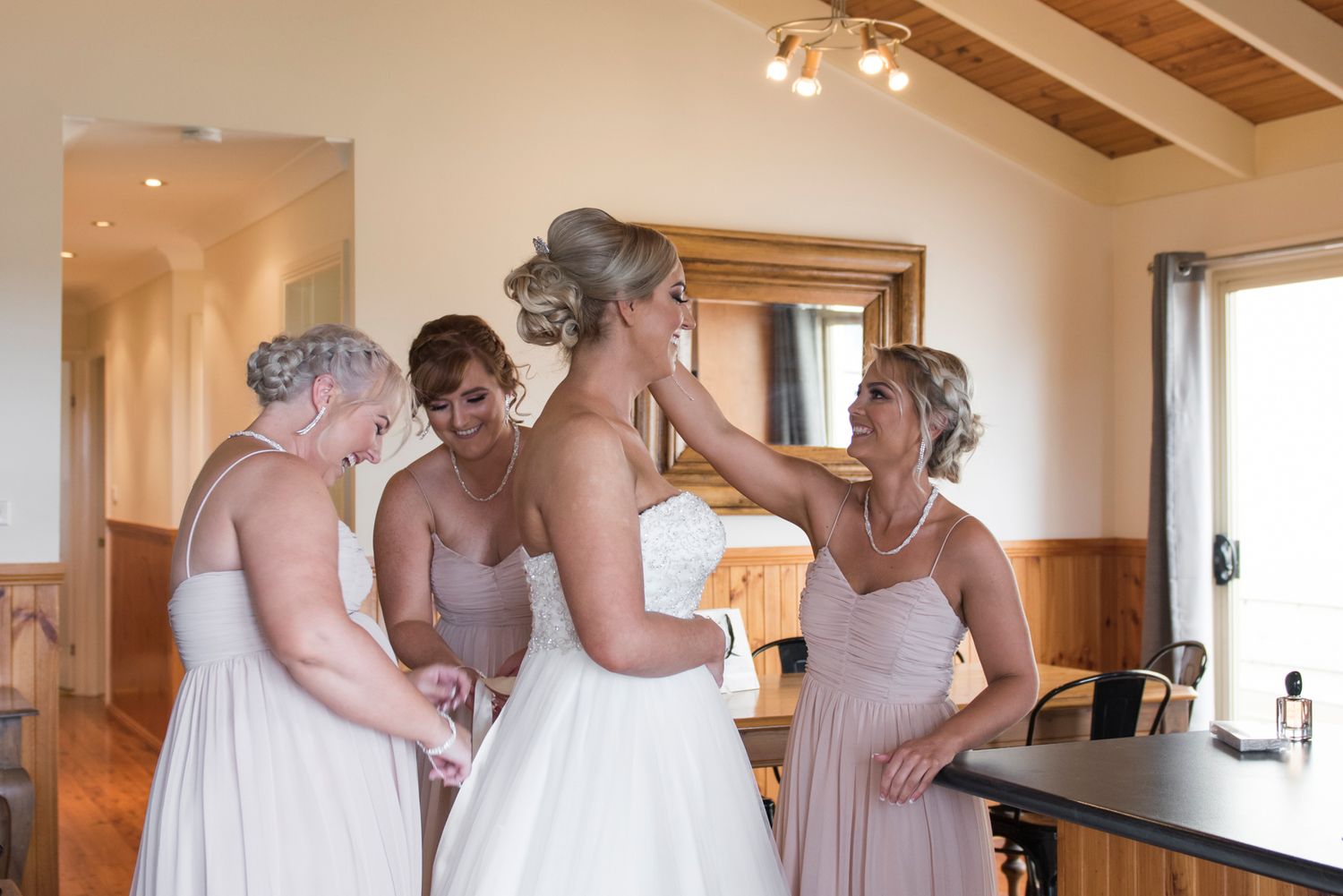Bride getting ready with bridesmaids.