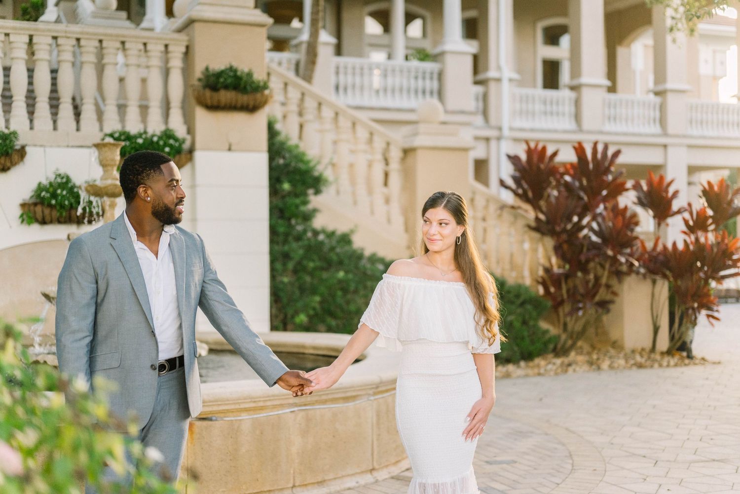 Engagement session in Naples, FL with soft golden light.