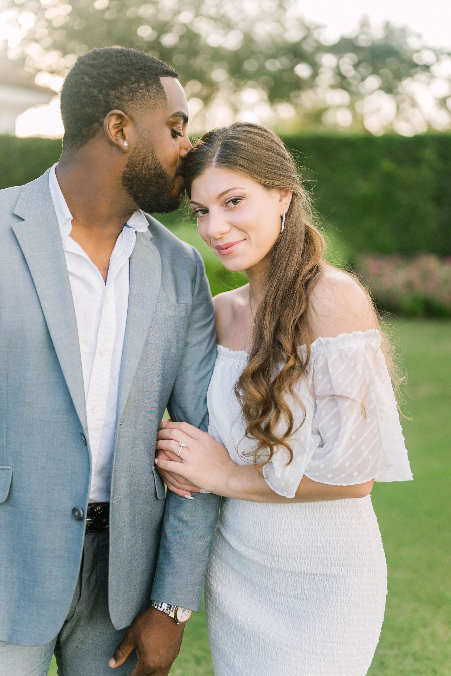 Modern outdoor couple’s portrait with warm evening light.