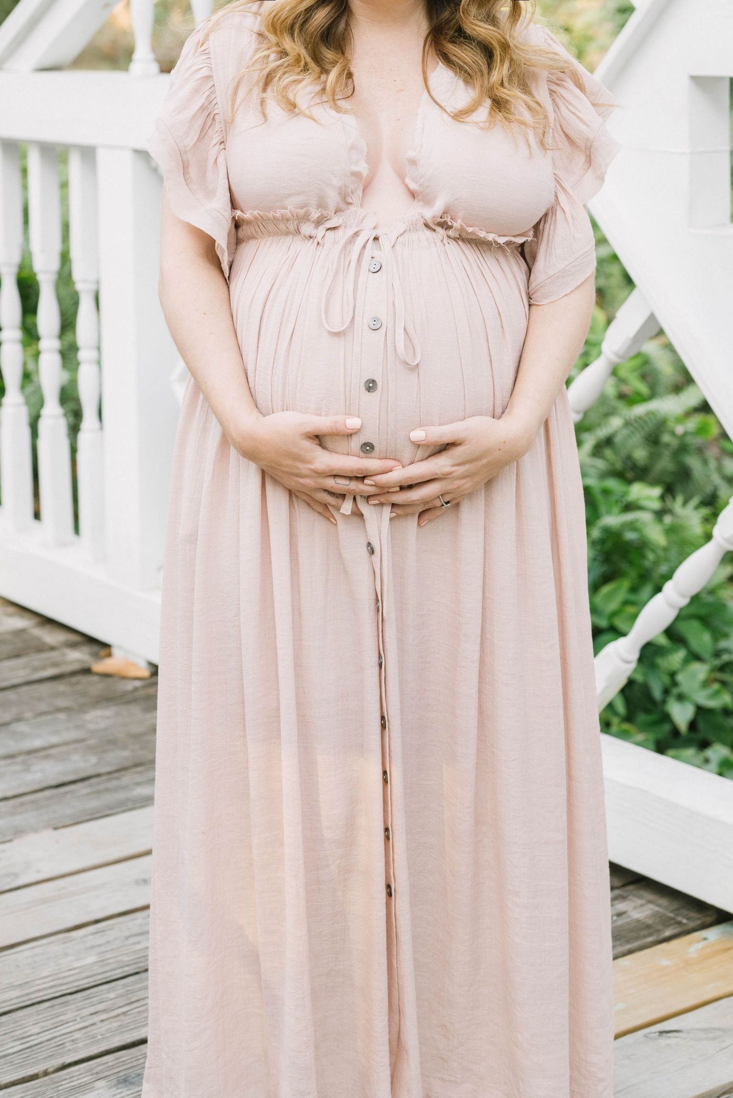 Maternity portrait at Koreshan State Park with soft golden light.