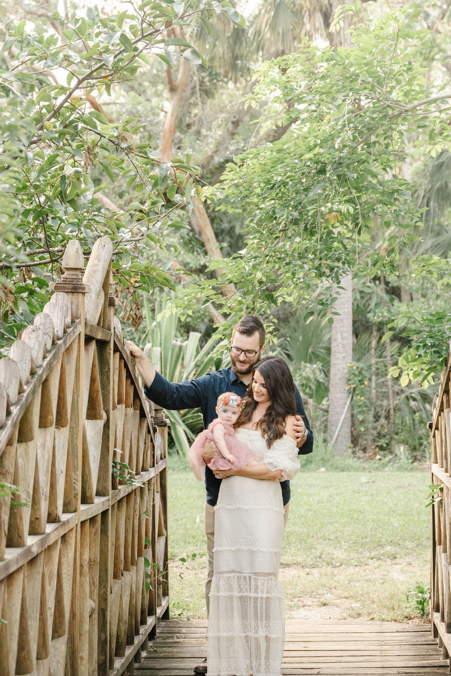 Lifestyle family portrait at Koreshan State Park with soft golden light.