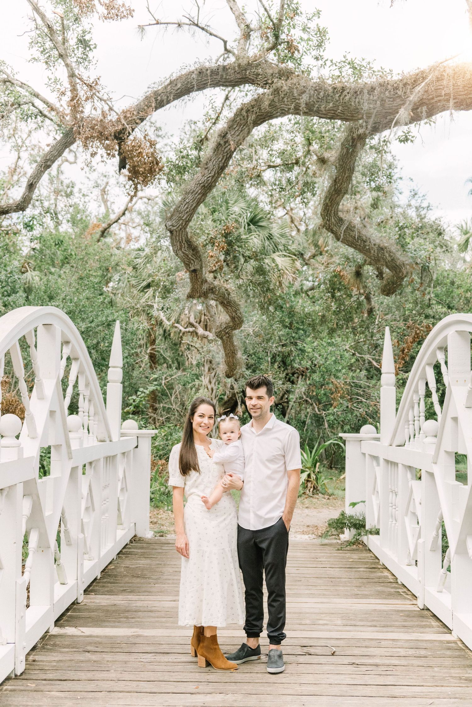 Lifestyle family portrait at Koreshan State Park with soft golden light.
