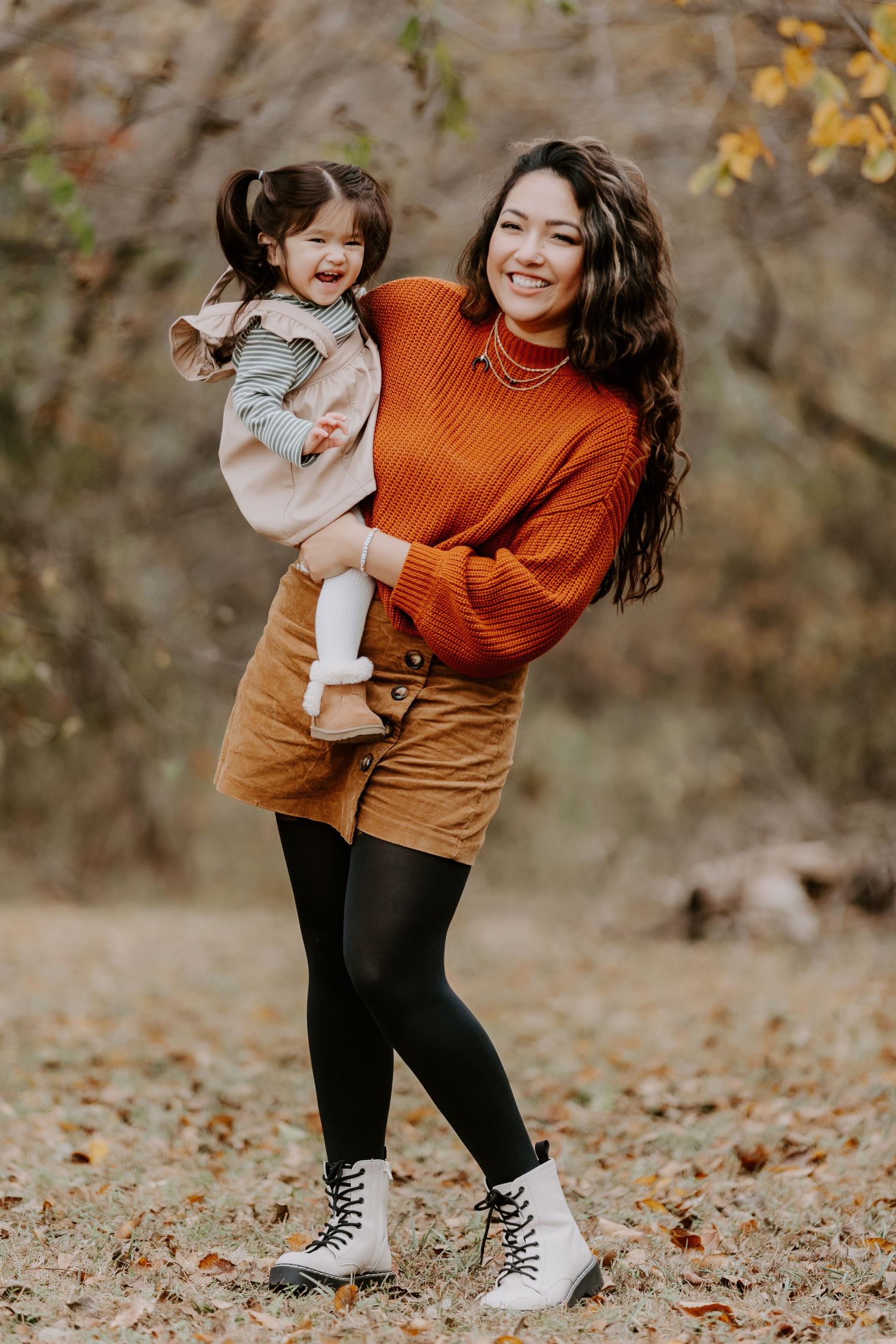 Candid photo of parent Rebecca Glass Photography holding their baby during Oklahoma City family session.
