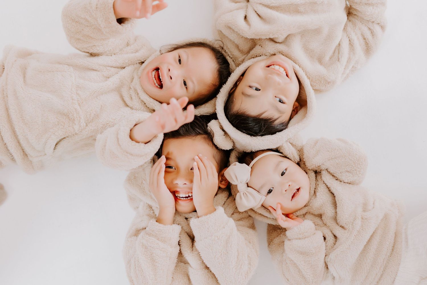 Above family portrait of cousins dressed in cozy clothes while at an OKC studio session.