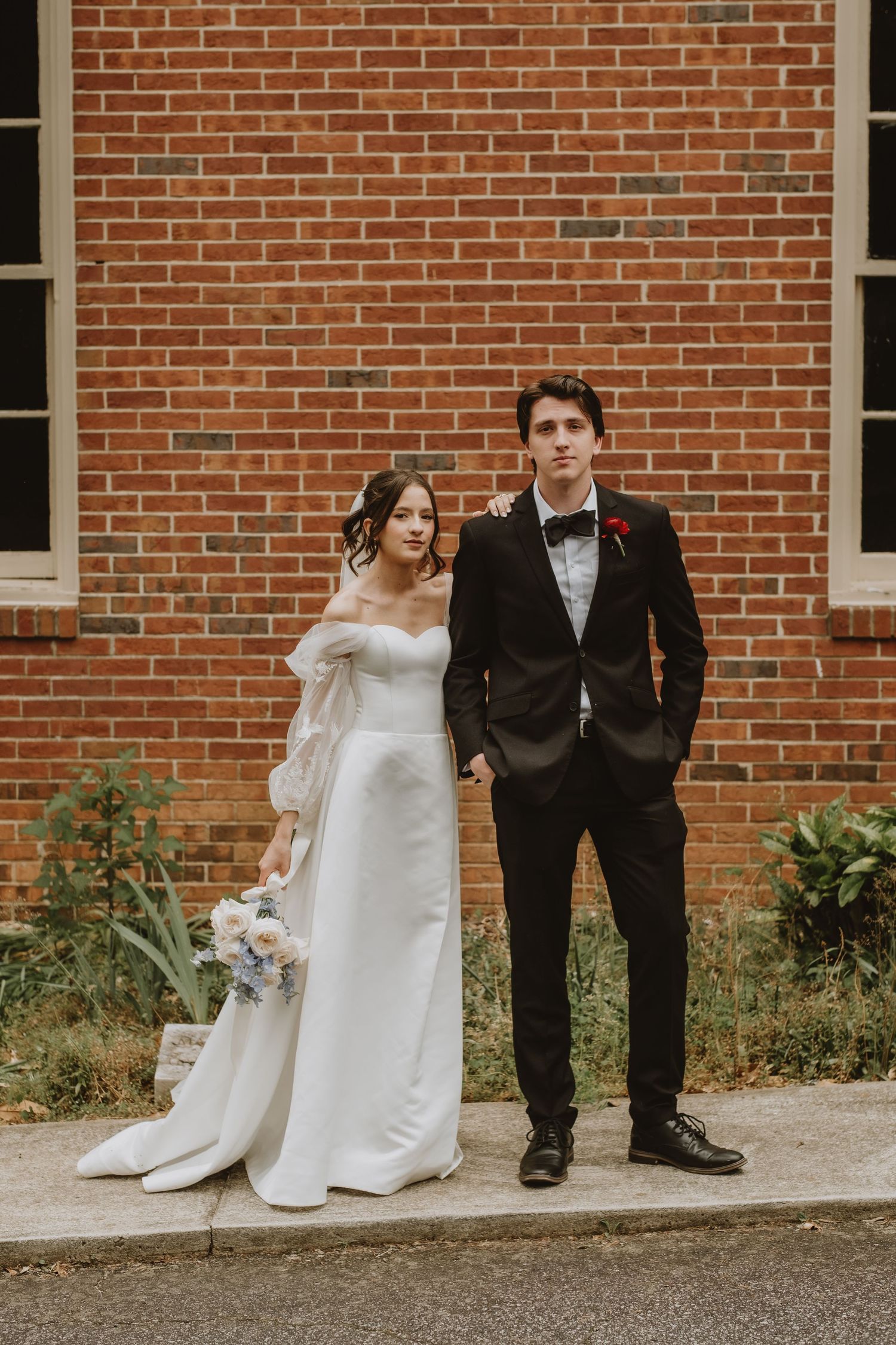 A playful sequence of wedding photos showing a couple posing against a brick wall in formal attire.