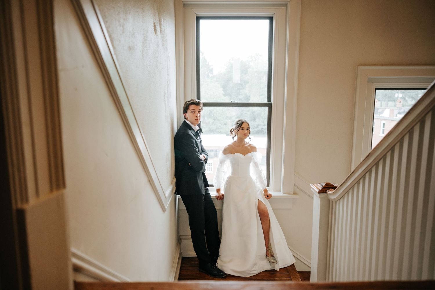 A series of artistic wedding photos captured through a window frame with natural lighting.