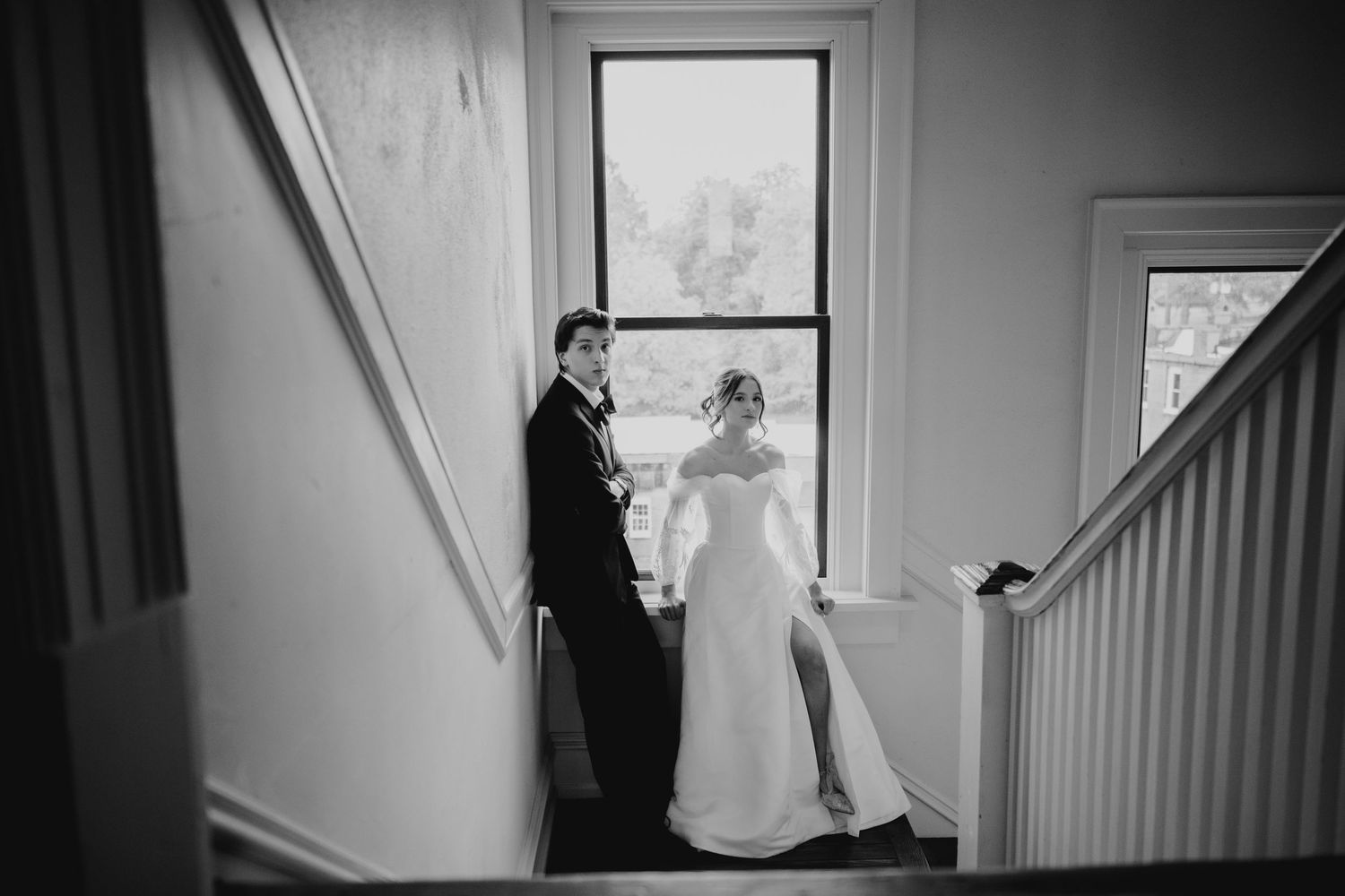 Dramatic black and white wedding photos captured in window light.