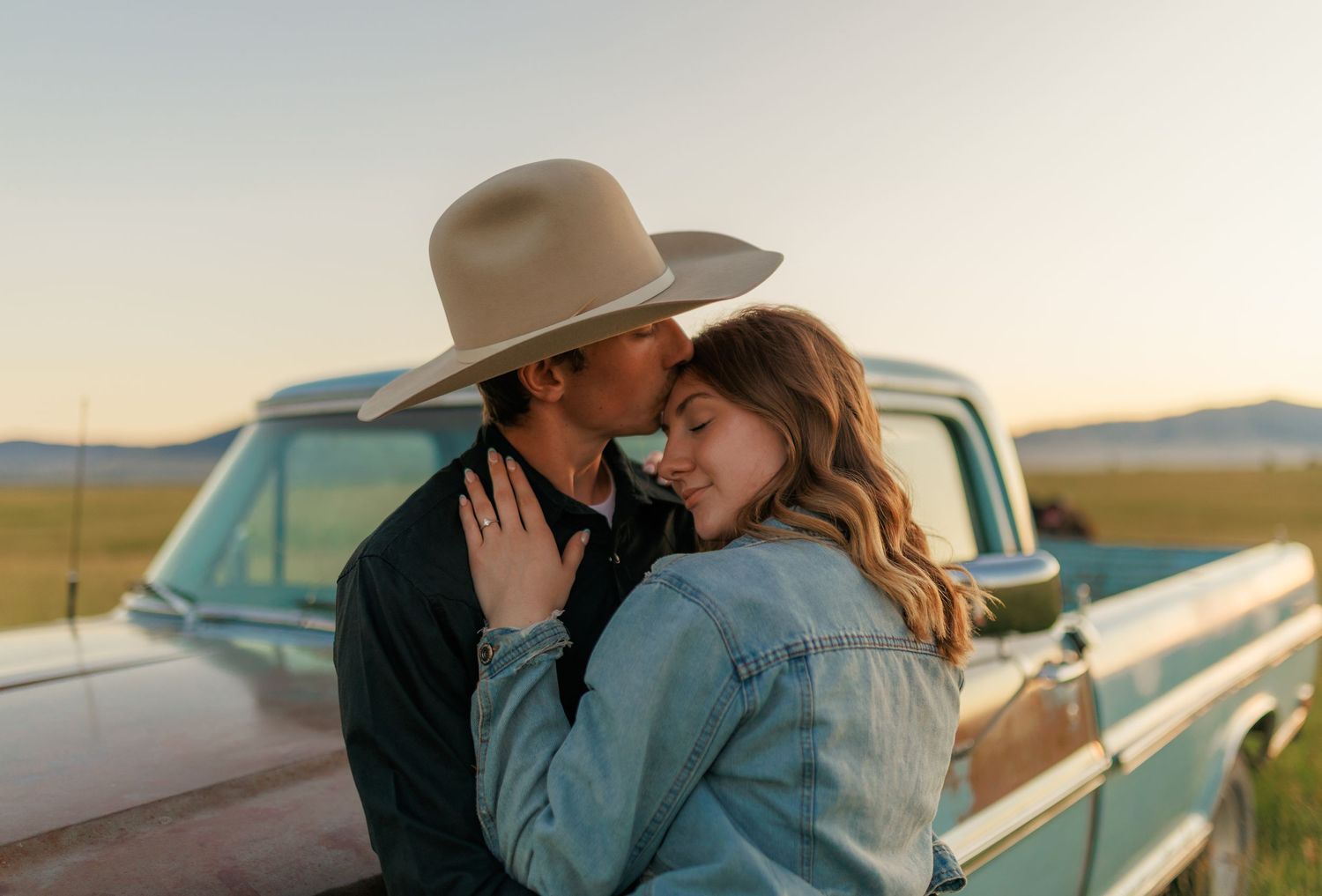 Sweet moments captured between a couple in a rustic prairie setting.