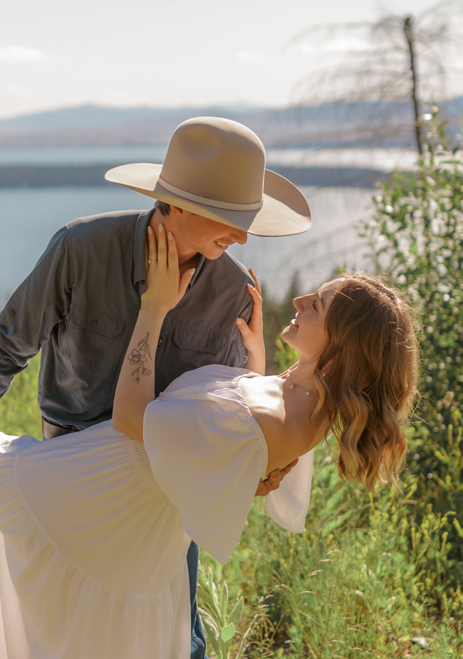 Romantic summer portraits captured in a scenic mountain wildflower field.