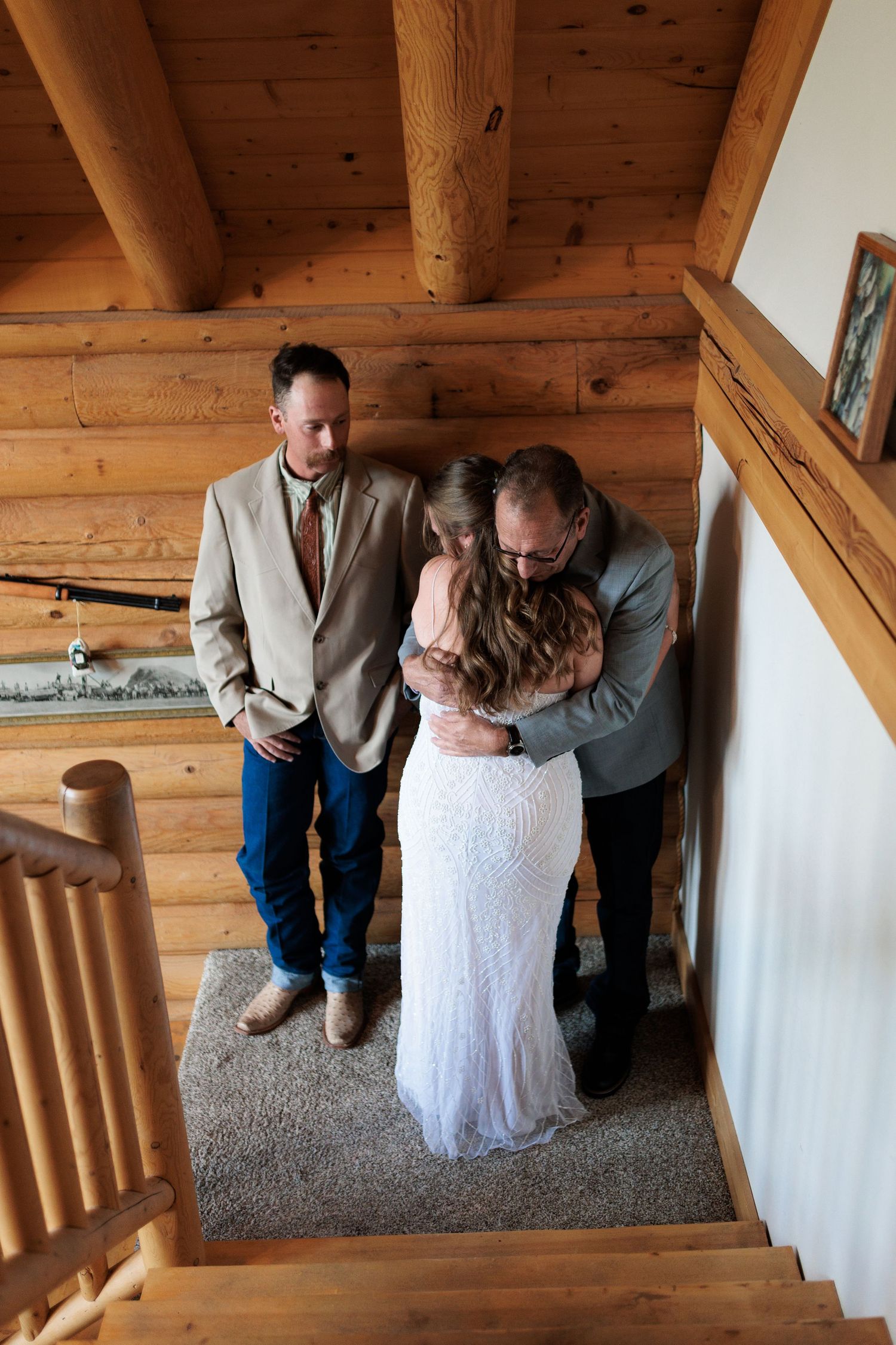 Bride doing a first look with her dad and brother before intimate ceremony in Red Lodge, MT.
