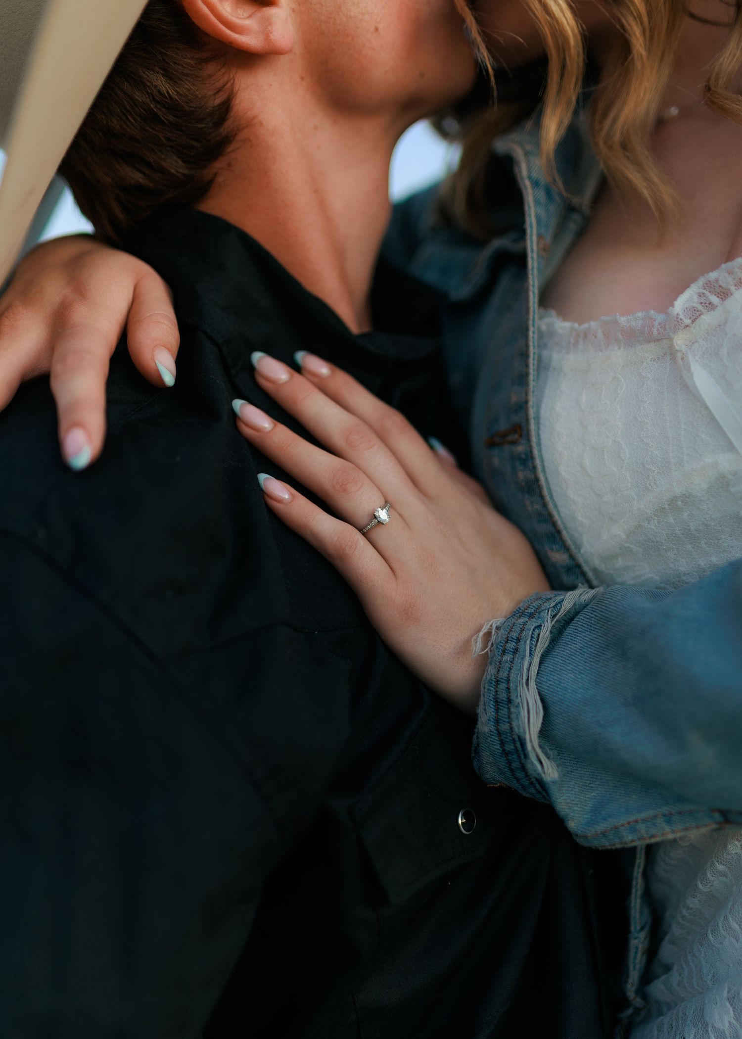 Close-up shots highlight tender moments and an engagement ring.