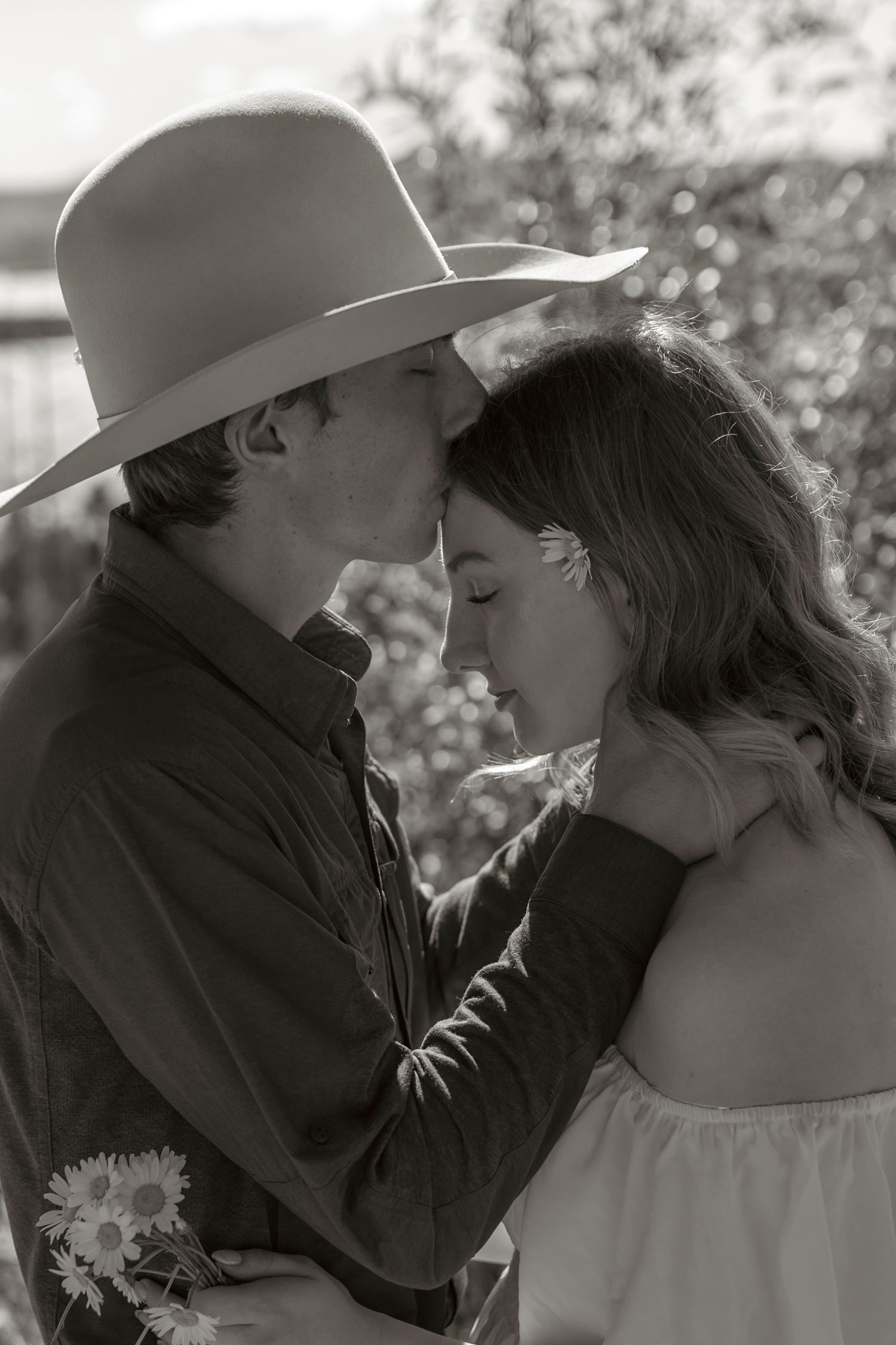 A series of intimate black and white photos showing a tender moment between two people.