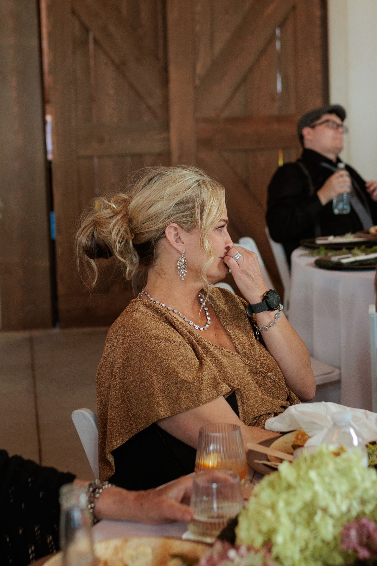 mother of the bride getting emotional listening to wedding speech at Montana wedding