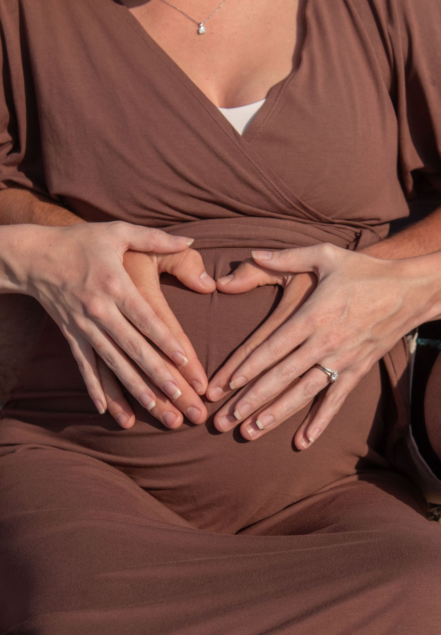 Close-up sequence of hands with rings resting on brown fabric showing different poses and angles.