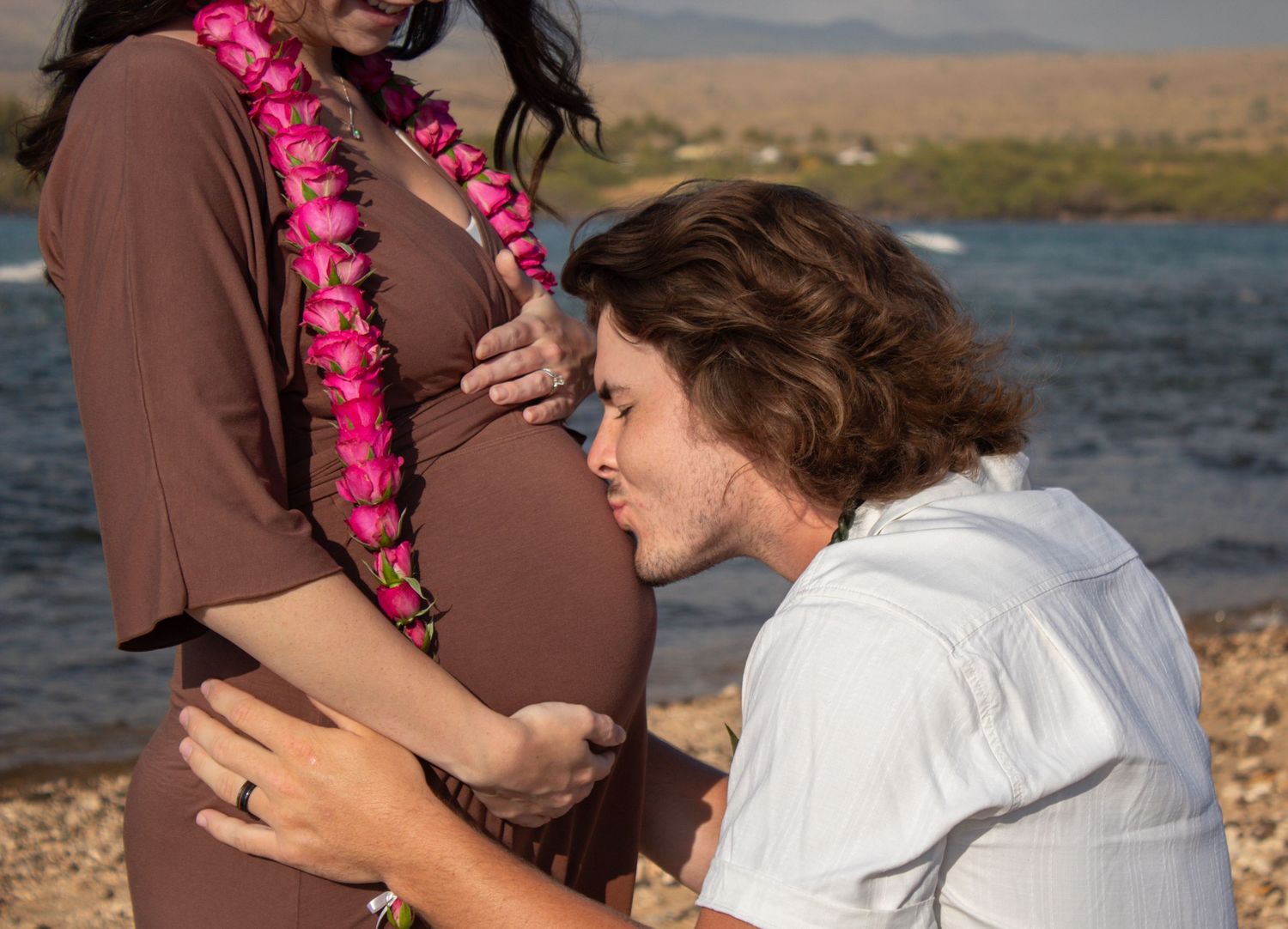 A romantic maternity photoshoot sequence shows tender moments between a couple by the water wearing brown and white outfits.