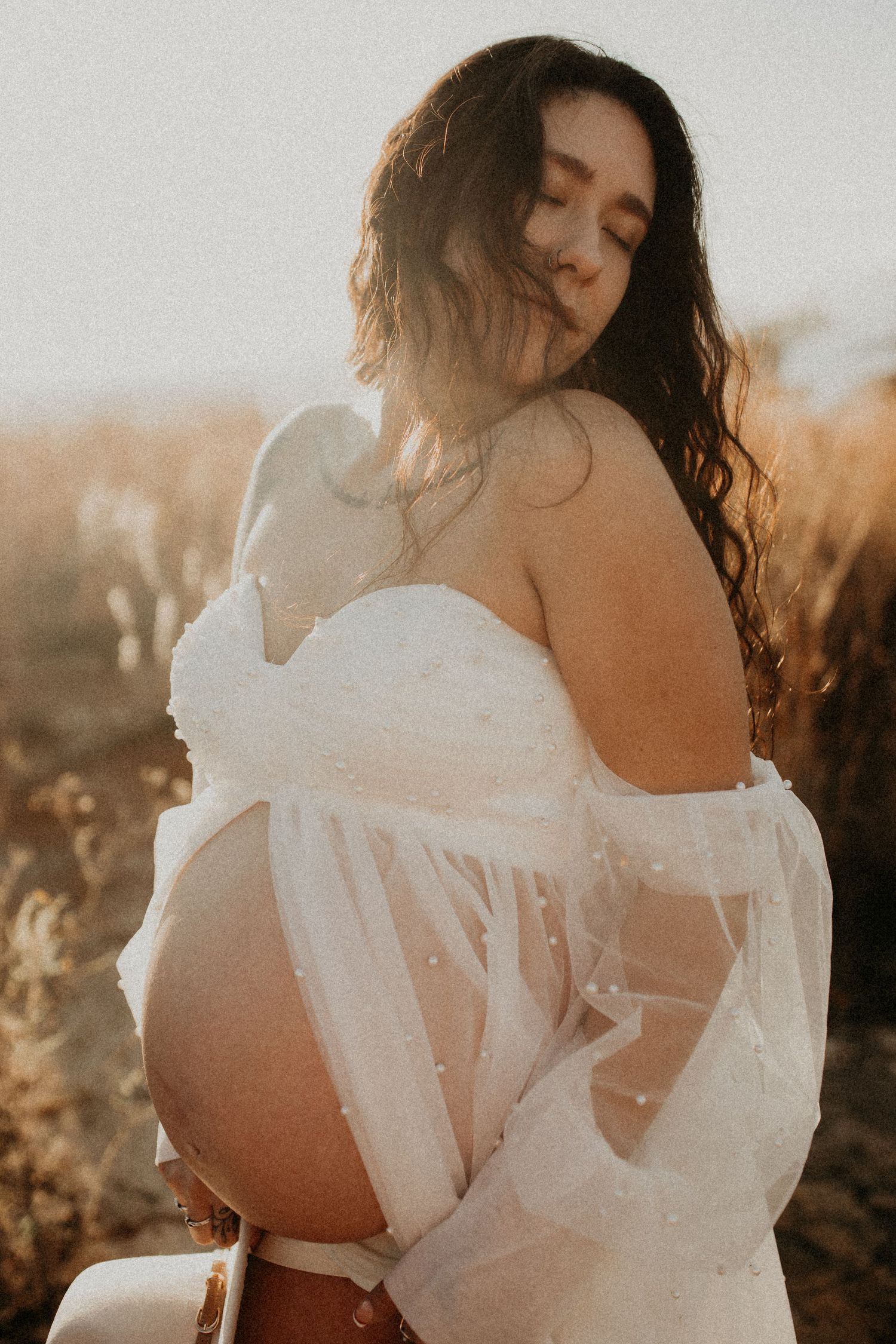 A series of ethereal portraits showing a person in a flowing white dress posing against a dreamy sunset backdrop.
