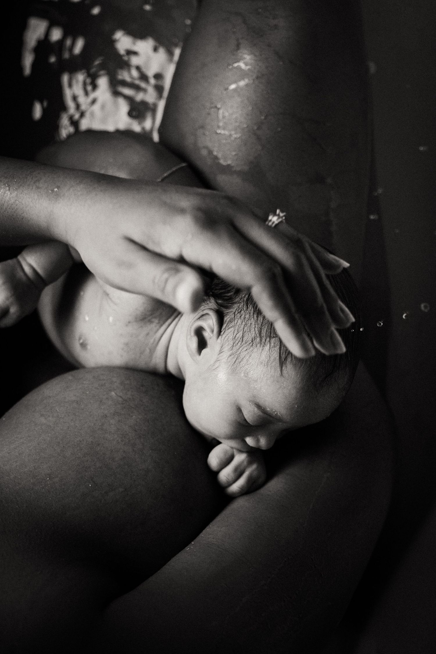 Intimate black and white portraits showing gentle moments of rest and connection.