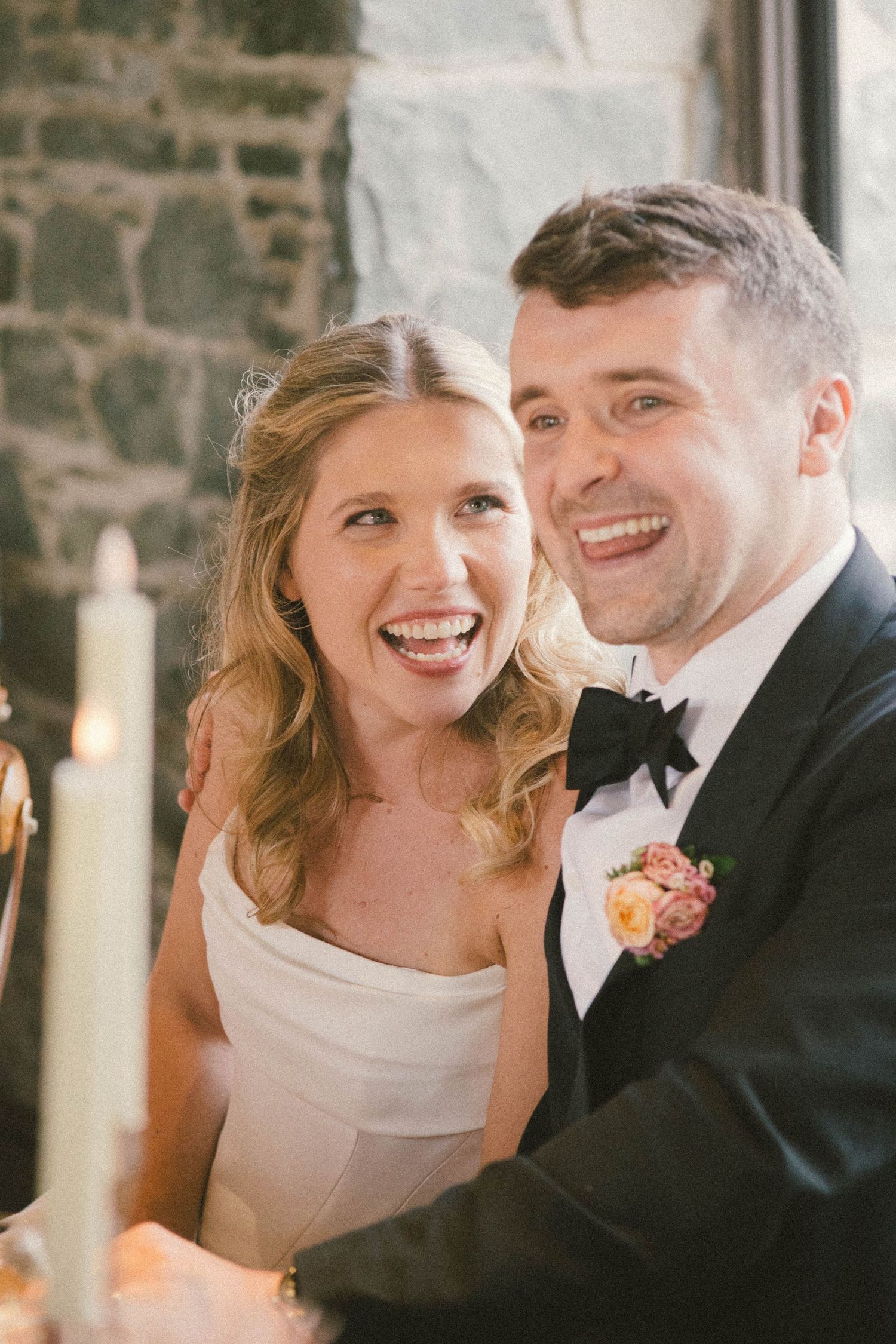 A romantic wedding moment captured in candlelight with soft glowing ambiance.