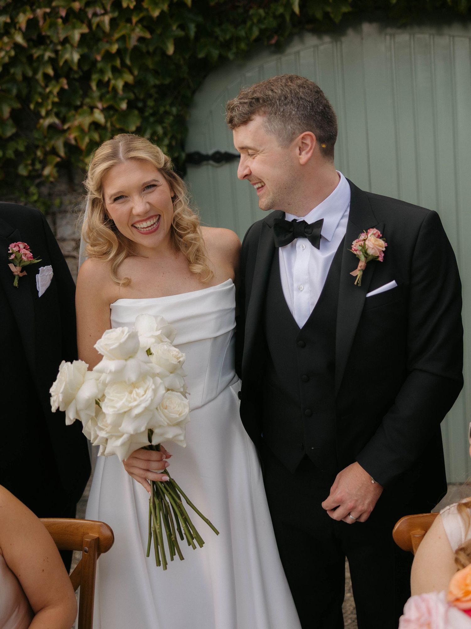 Intimate wedding moments captured against a garden backdrop.
