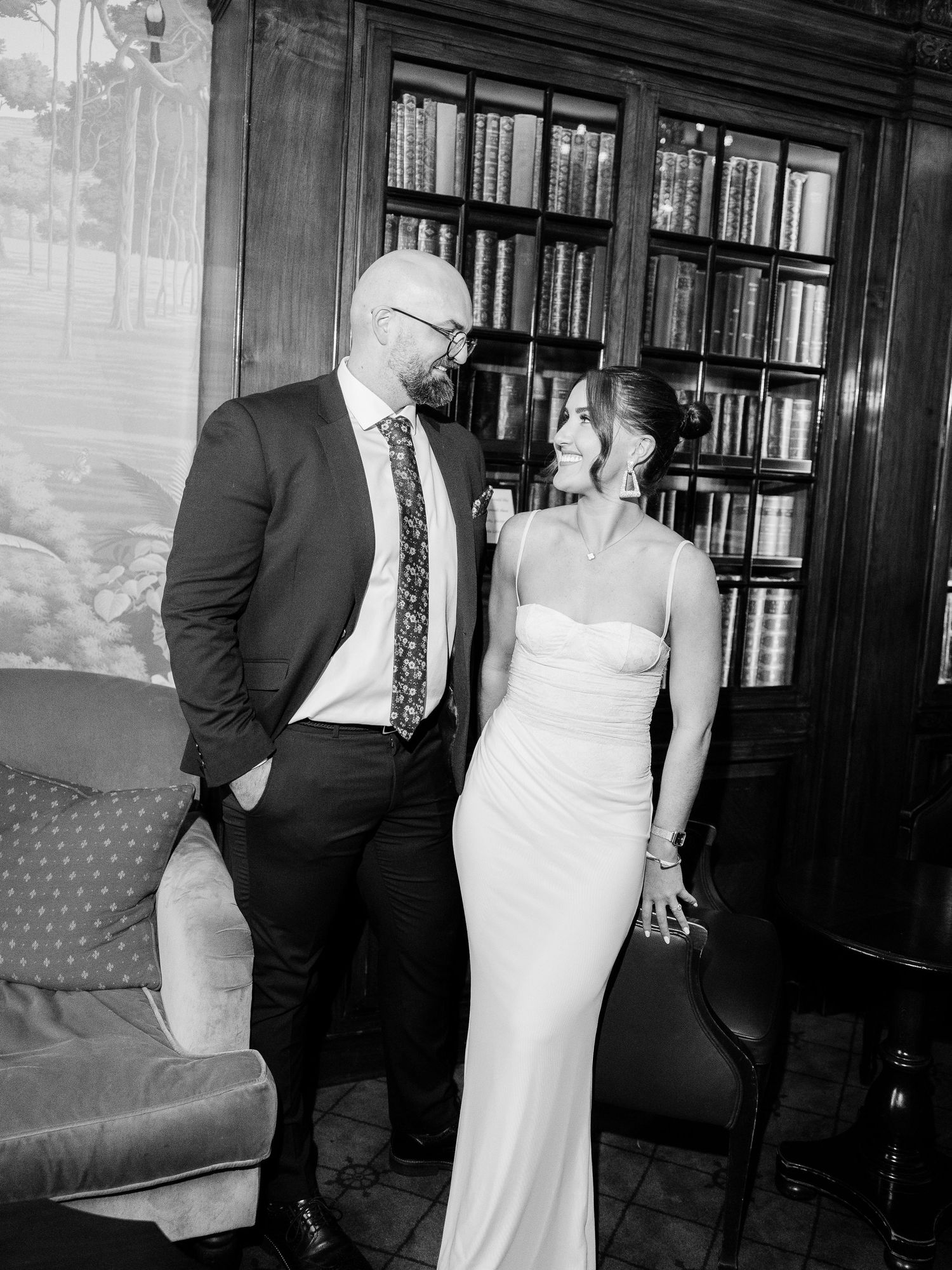 A romantic bride and groom share intimate black and white moments together during their wedding reception.