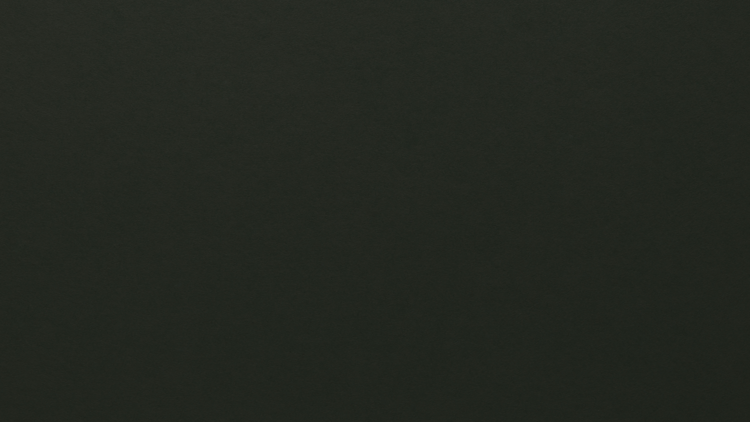 A solid dark green colored background texture or pattern.