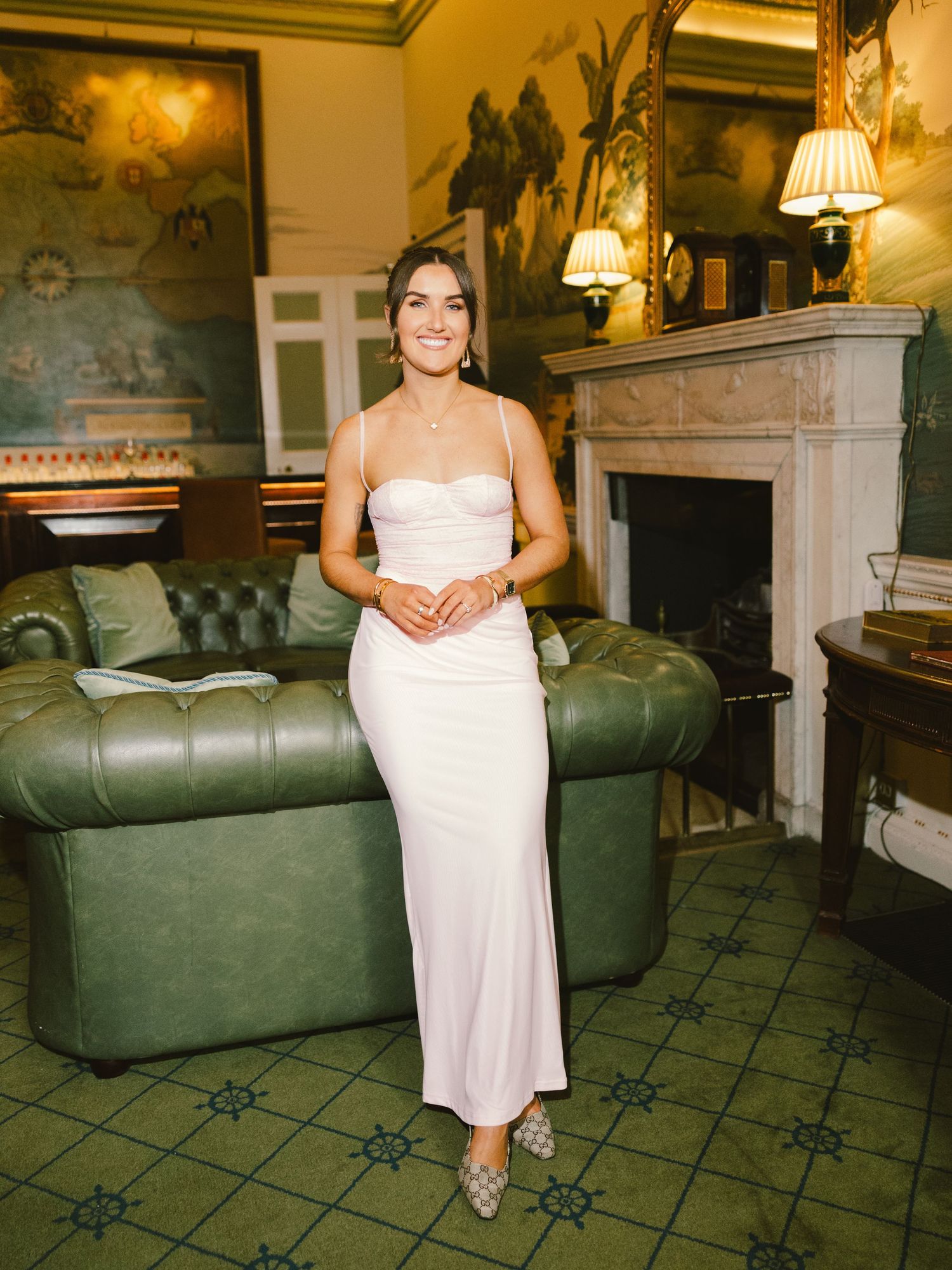 Elegant photo series showing different angles of a person in a white dress seated on a vintage green couch in a formal room.
