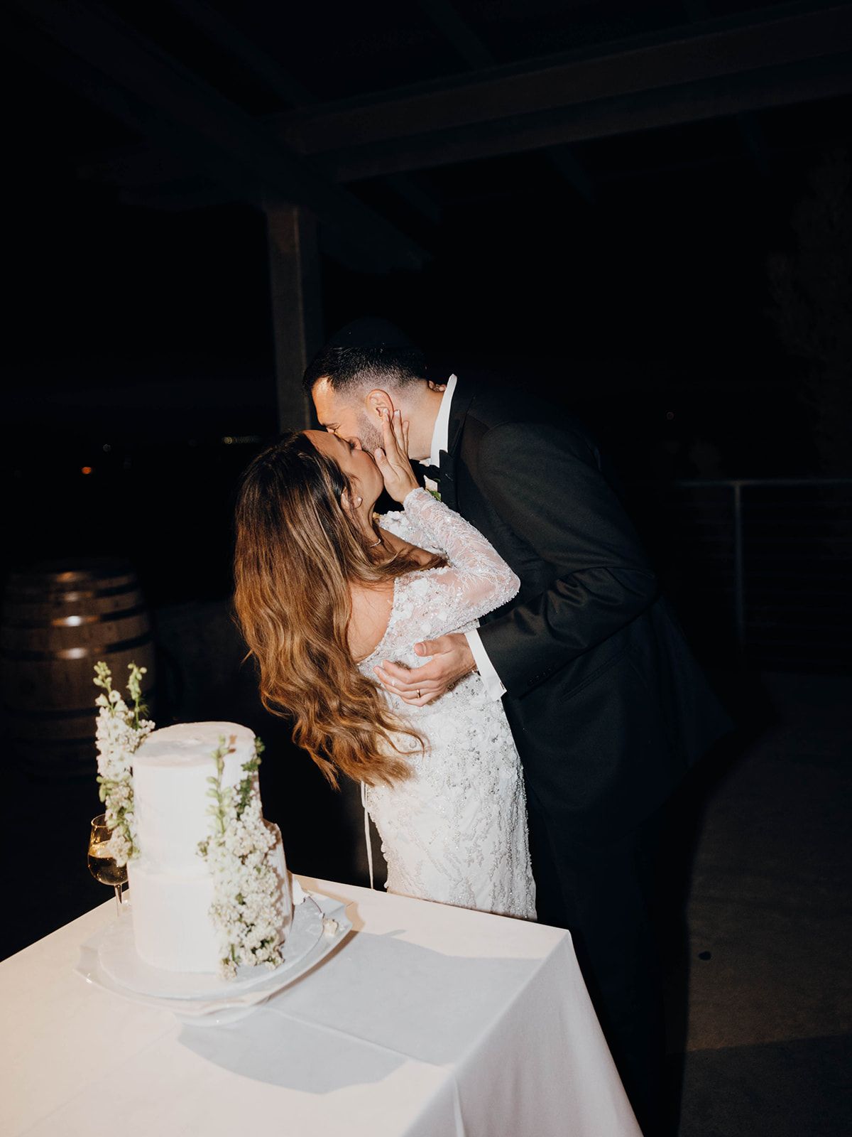A romantic moment between newlyweds as they share their first bite of wedding cake.