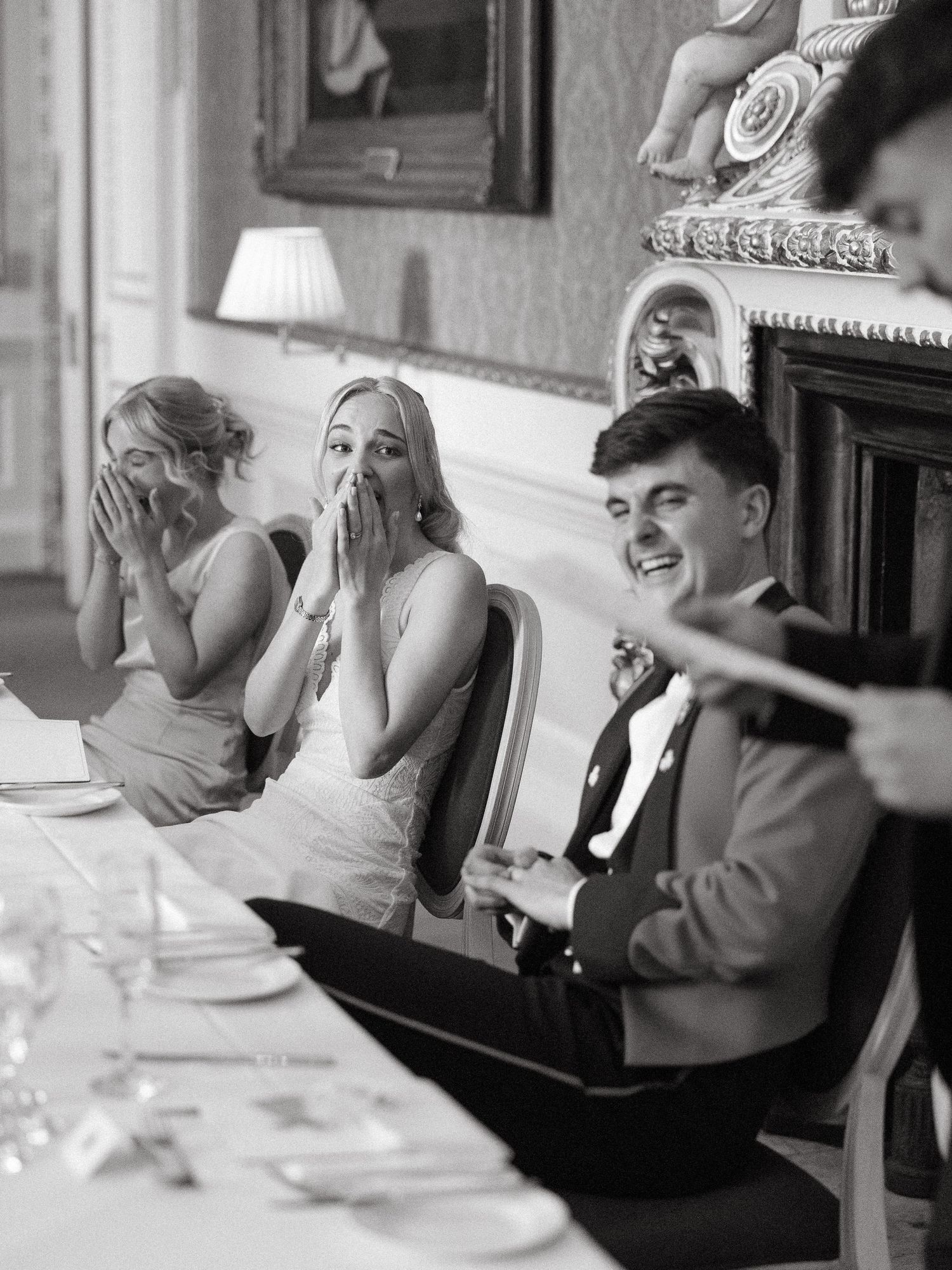 A sequence of black and white photos showing elderly people laughing and socializing around a dining table.