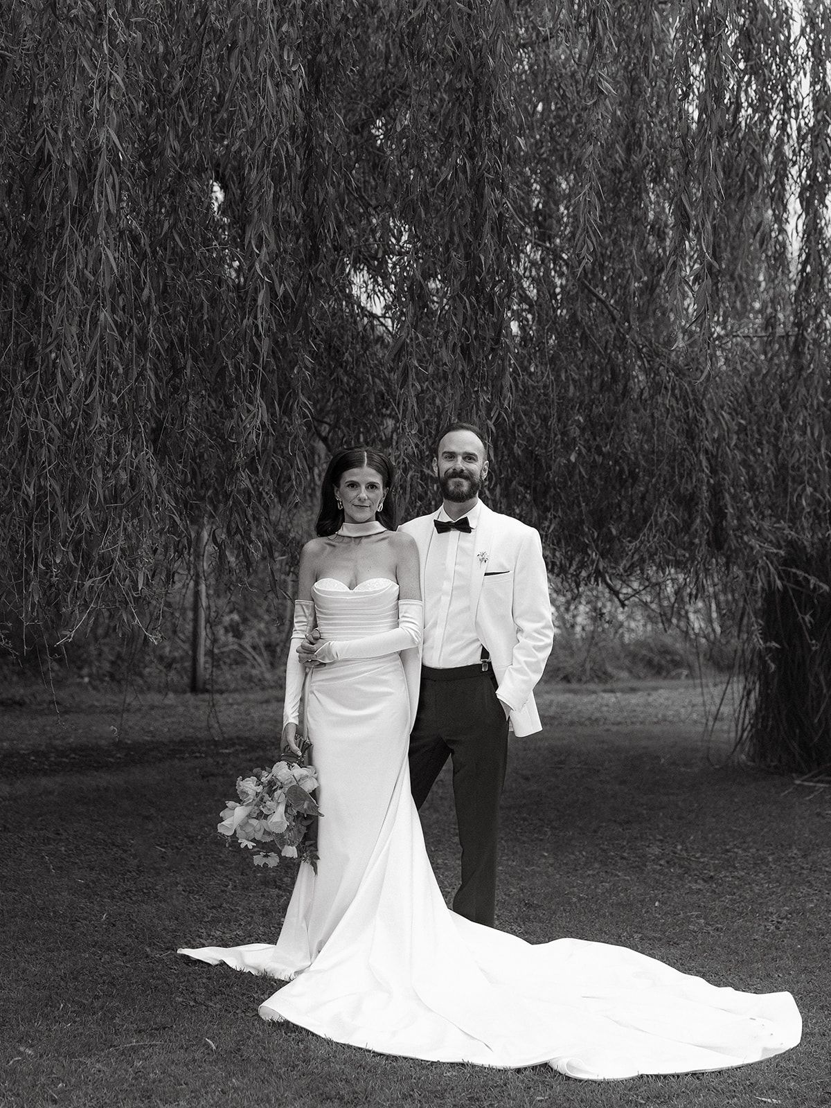A romantic wedding photo sequence showing a couple posing under drooping willow trees in an outdoor setting.