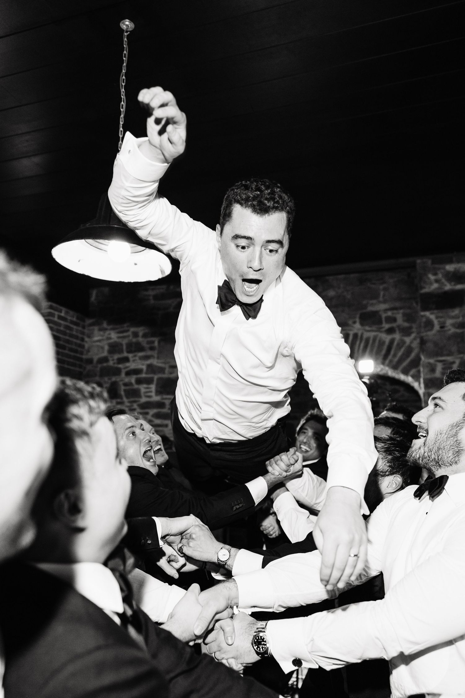 A black and white photo sequence shows an energetic crowd reacting with excitement at what appears to be a live performance.