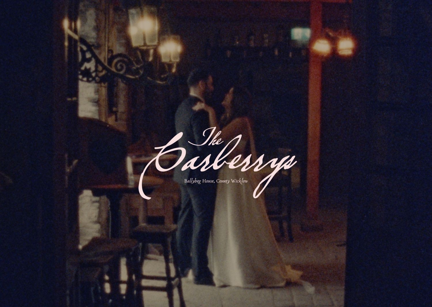 A couple shares a romantic dance at The Casberry wedding venue, bathed in warm ambient lighting.