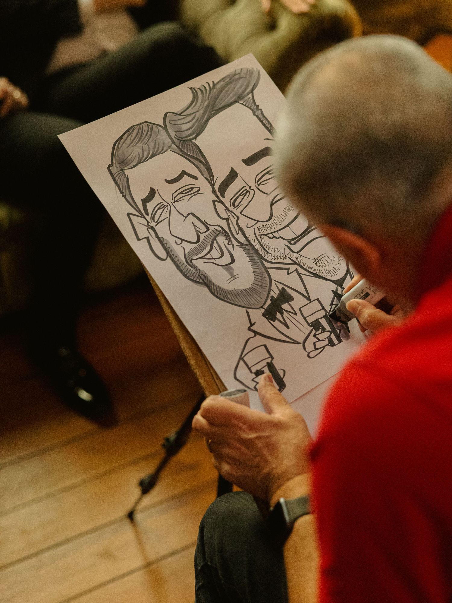 A series of caricature drawings being sketched in sequence showing the artistic process from start to finish.