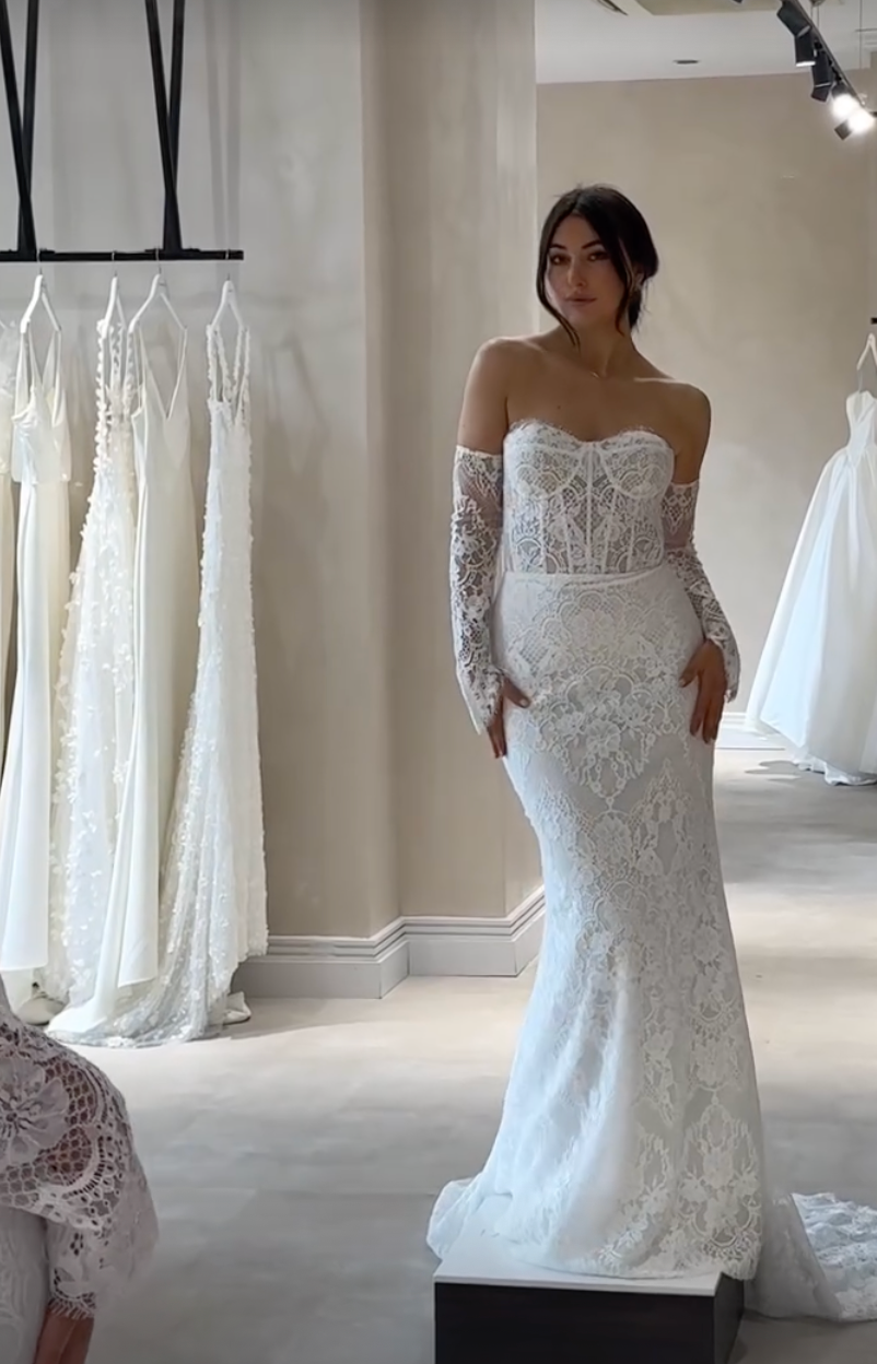 Multiple views of a delicate white lace wedding dress with off-shoulder design displayed in a bridal boutique setting.