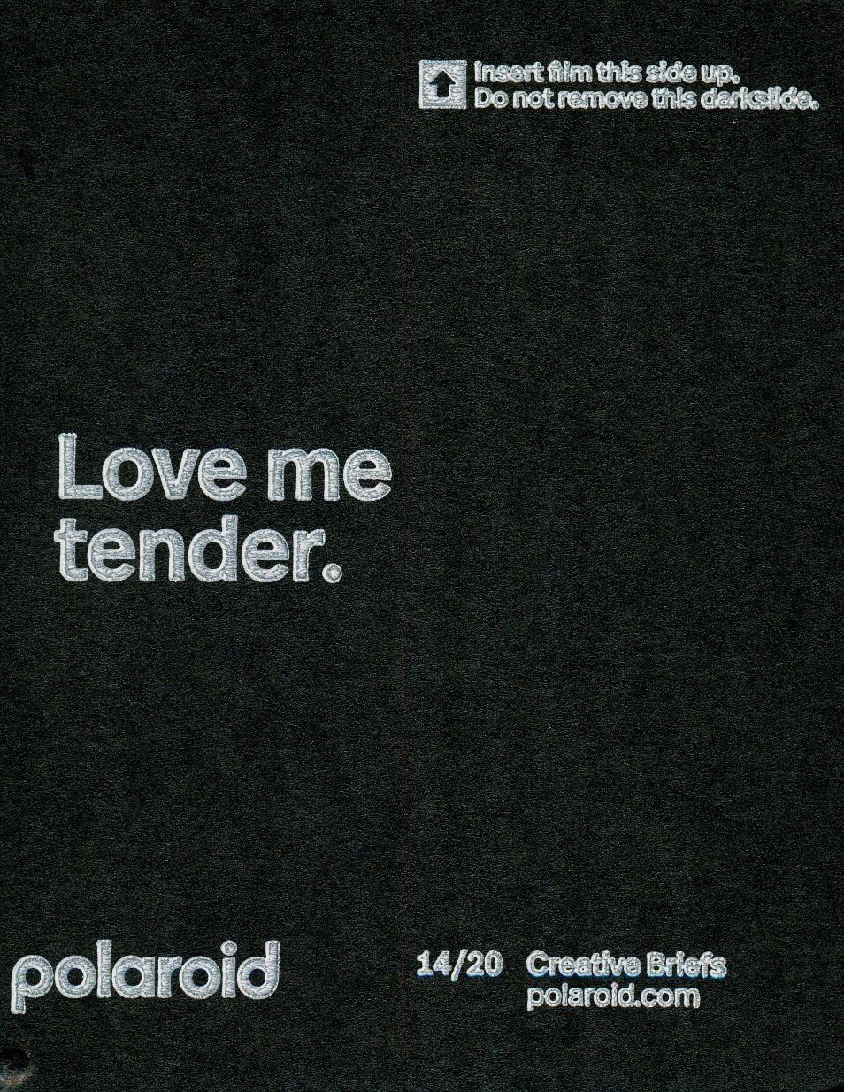 Black and white Polaroid advertisement showing text 'Love me tender' with creative briefs website URL.
