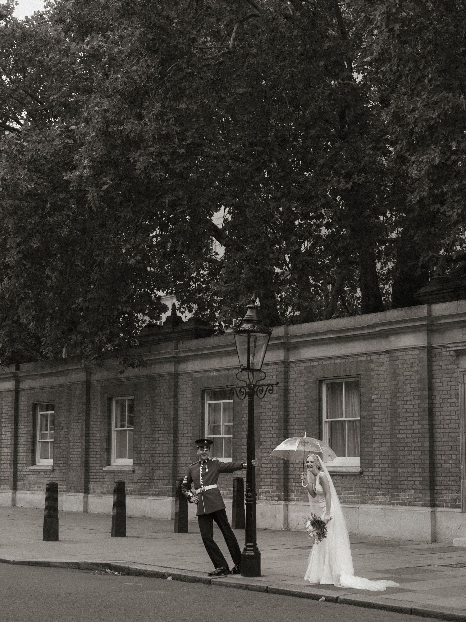 A sequence of black and white photos shows someone in a wedding dress walking along a brick wall with windows.