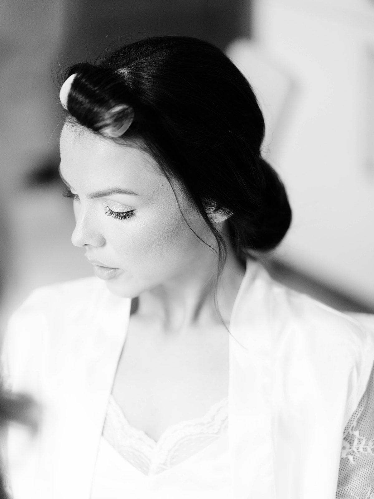 Artistic black and white portrait series showing ethereal close-up profile views with soft lighting and dreamy atmosphere.