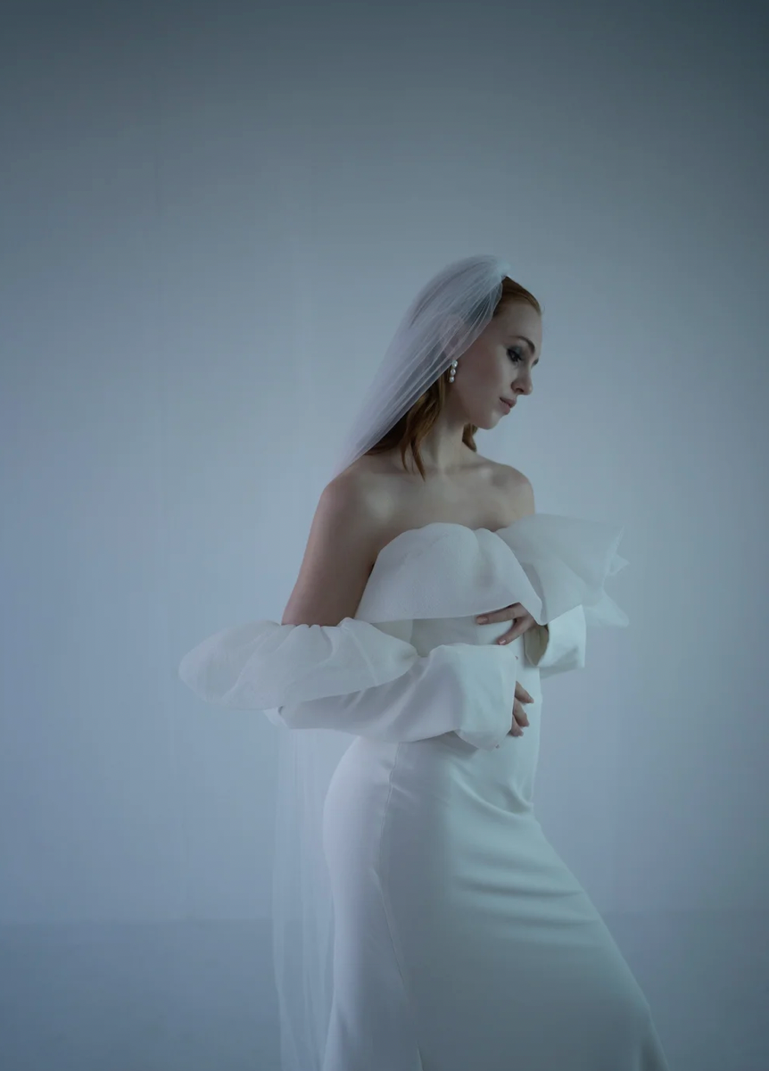 Ethereal artistic portrait series showing a figure in white against a misty blue background creating a dreamy atmosphere.