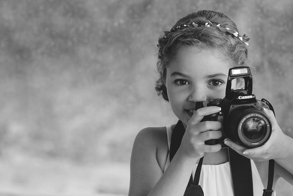 Series of vintage-style black and white portraits with cameras.
