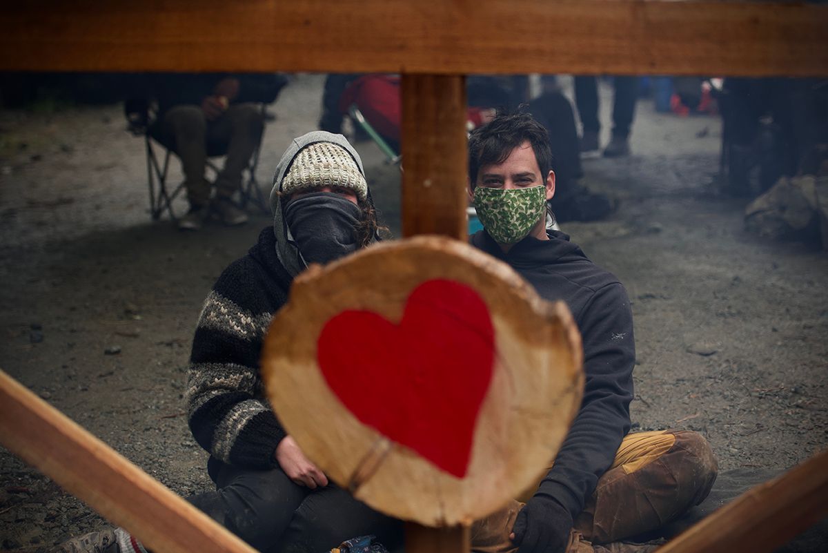 Fairy Creek blockade. A red heart symbol painted on a light-colored surface in an artistic style.