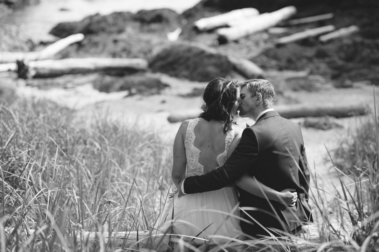 Black and white image of photographer working during outdoor photo session.