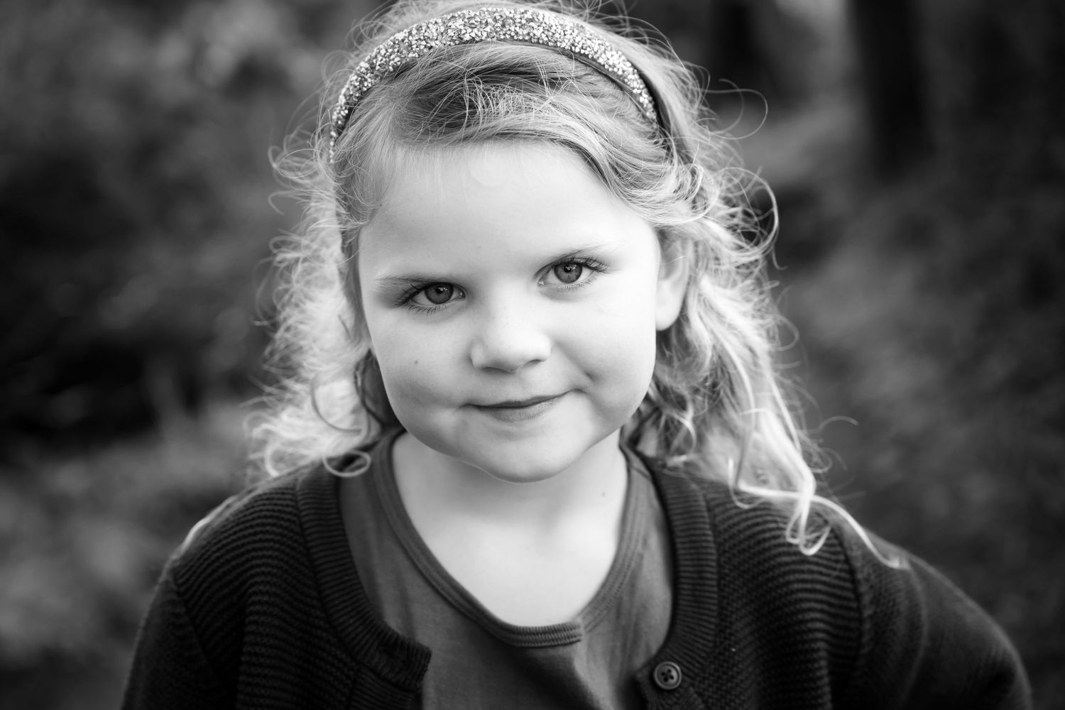 Black and white portrait series with soft natural lighting.