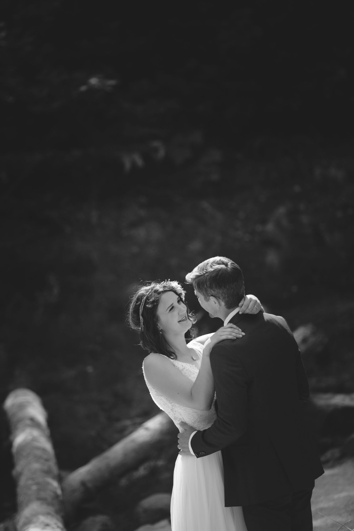 Intimate black and white portrait of newlyweds sharing a dance.